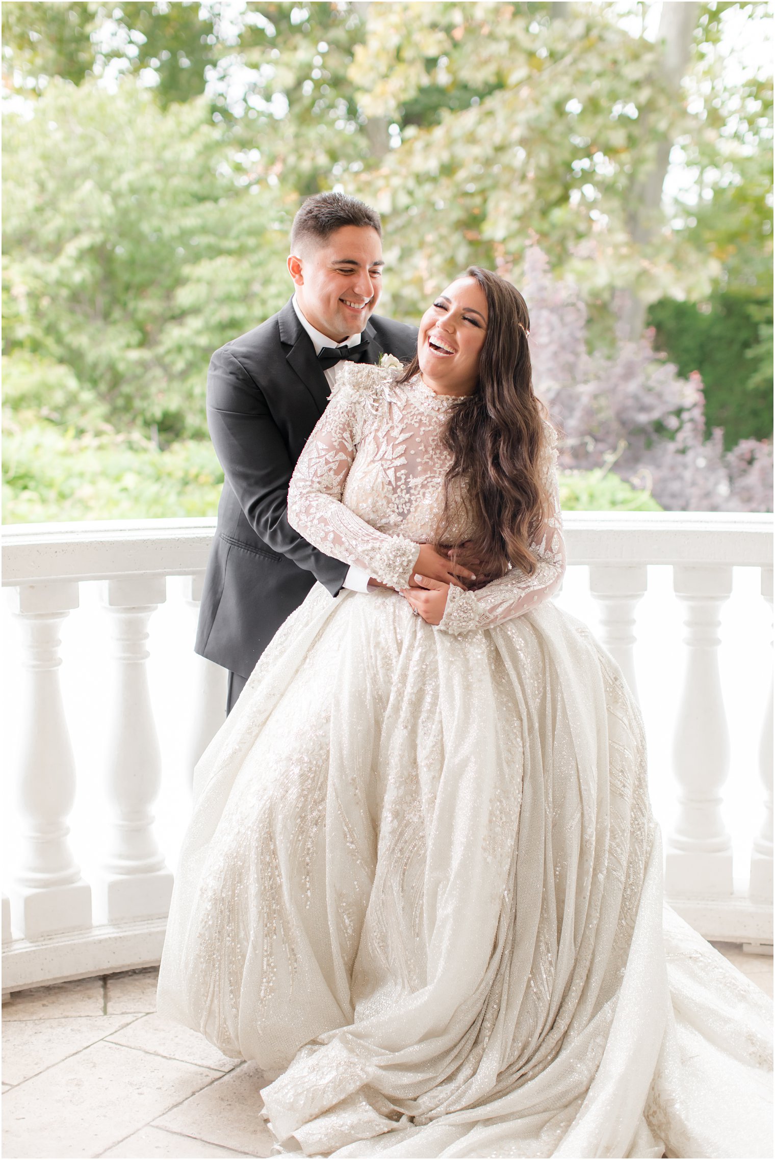 bride and groom laugh on patio at Nanina's in the Park