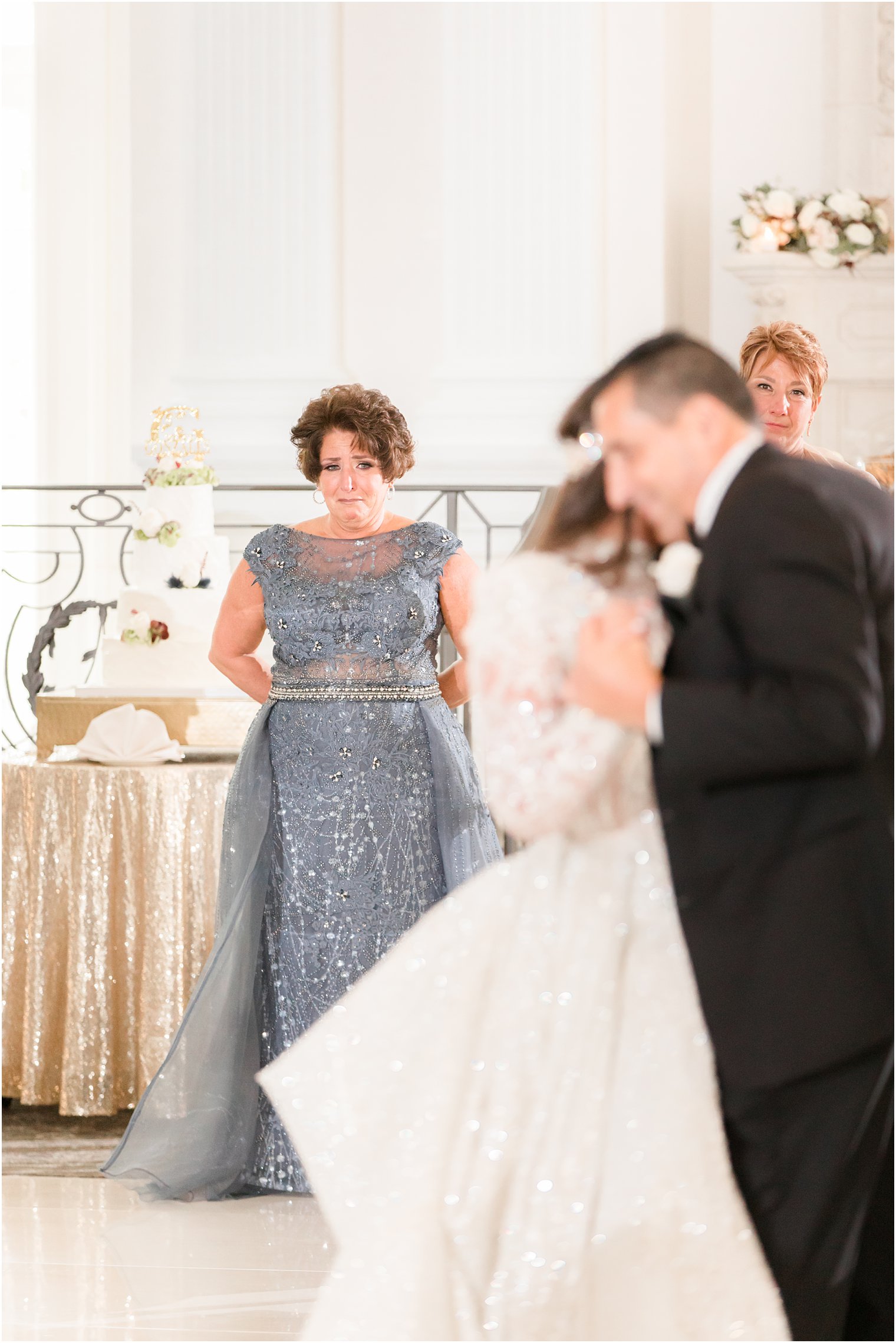 mother cries watching bride and dad dance