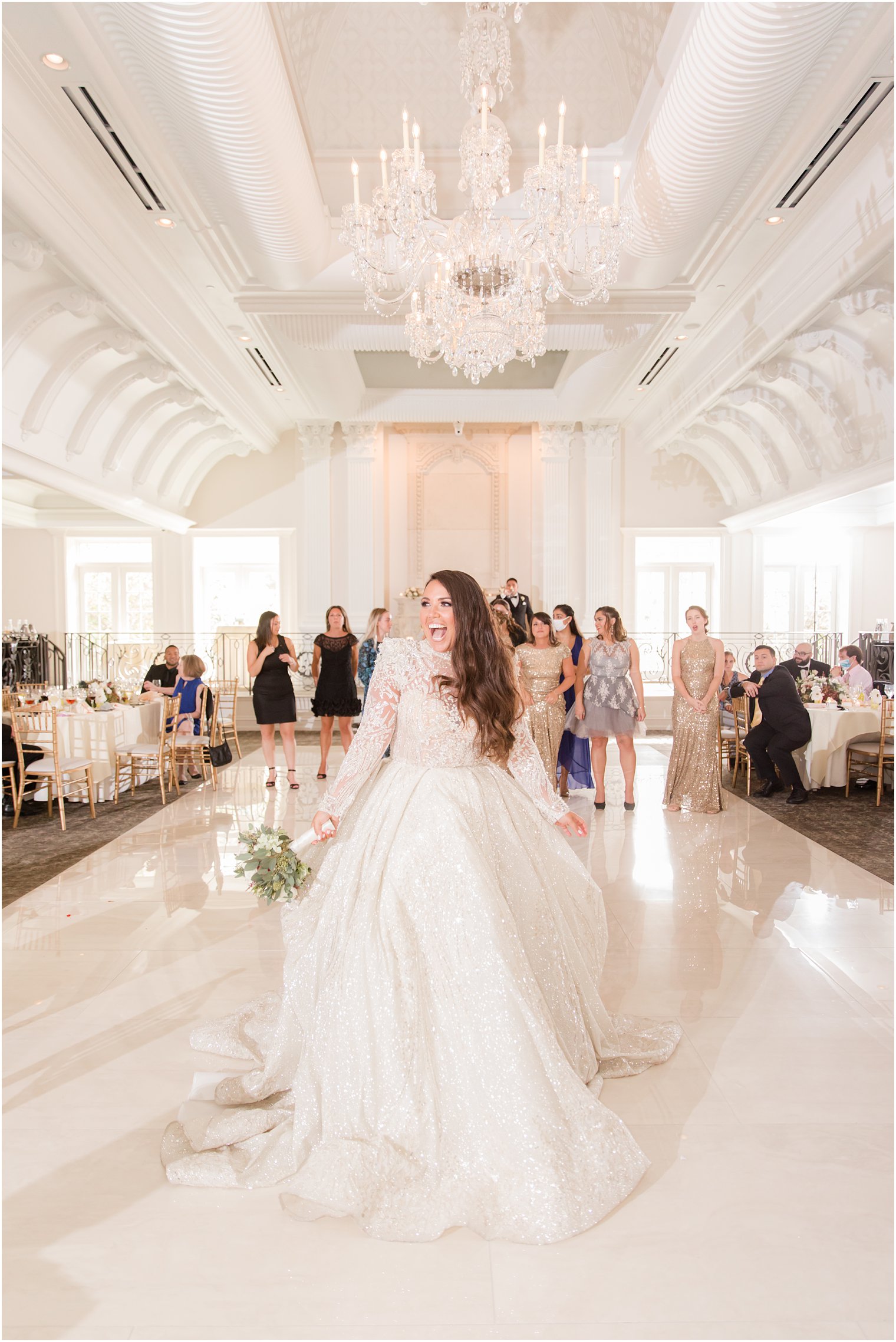 bride prepares for bouquet toss during Nanina's in the Park wedding reception