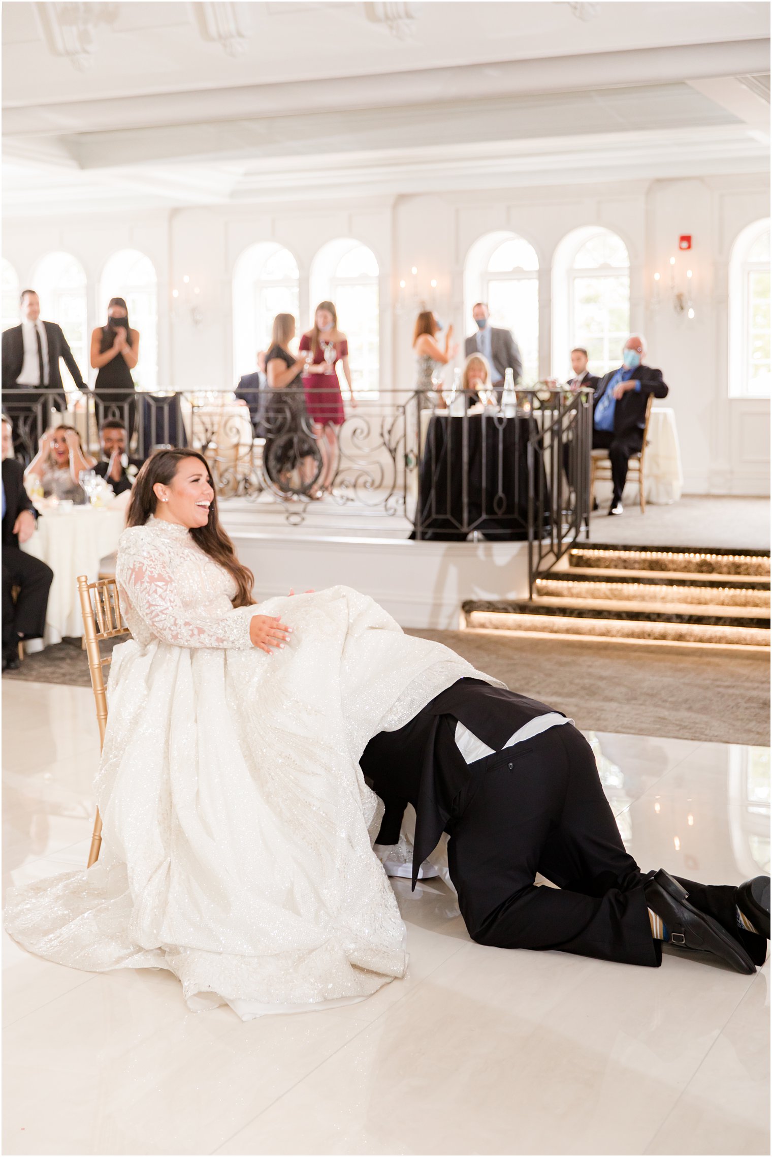 groom finds garter during NJ wedding reception