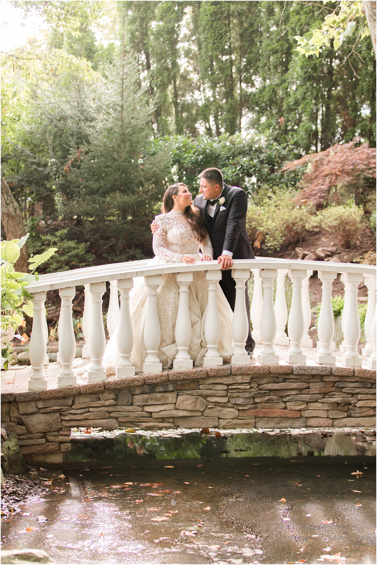 garden wedding portraits on bridge at Nanina's in the Park