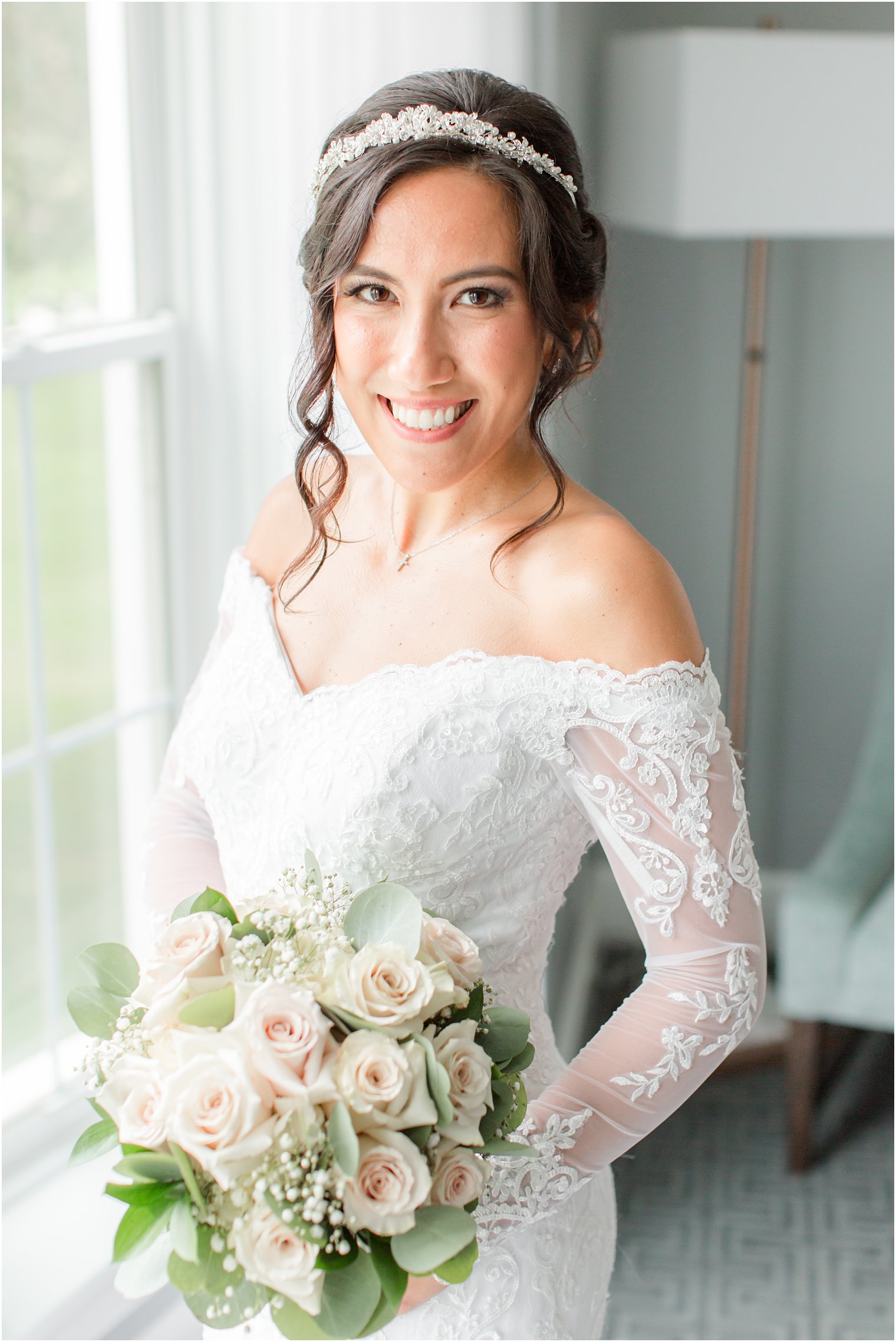 bride holds bouquet by hip during portraits at Seaview Hotel