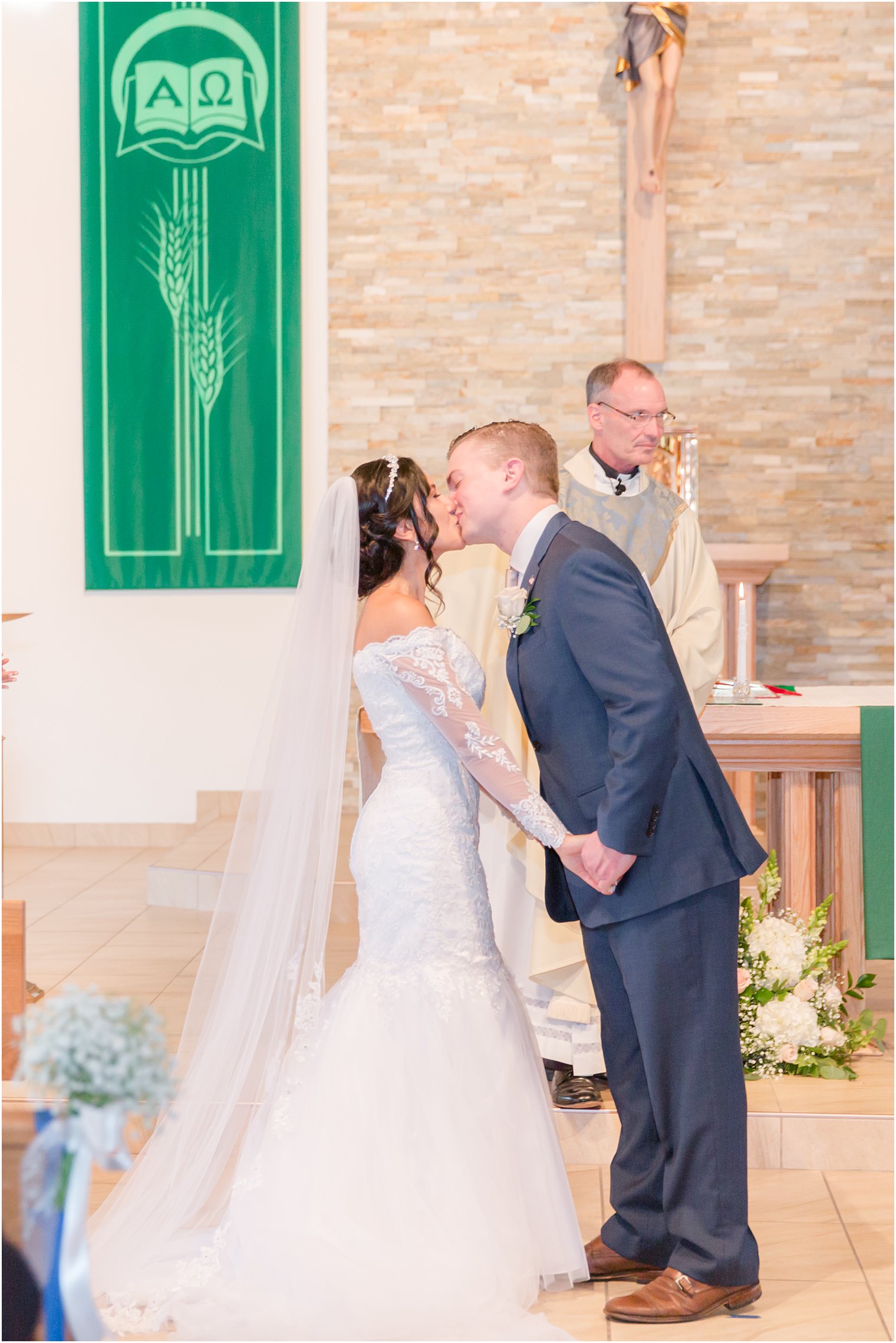 first kiss during traditional church wedding in New Jersey