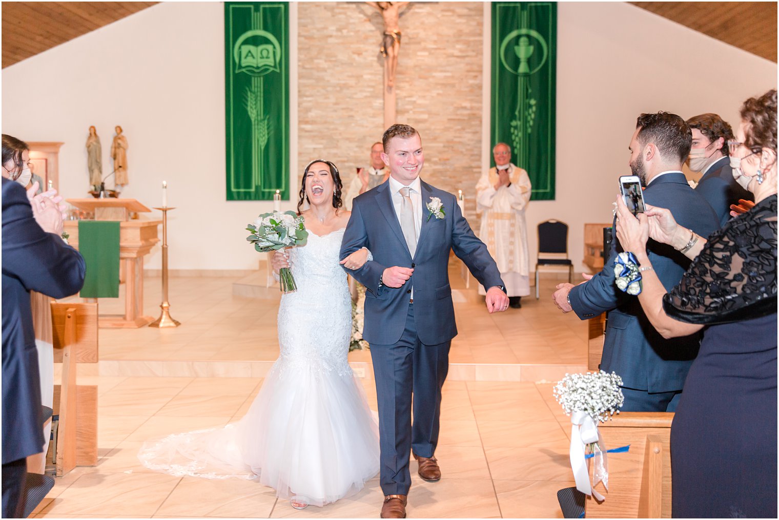 newlyweds leave church after traditional church wedding in New Jersey
