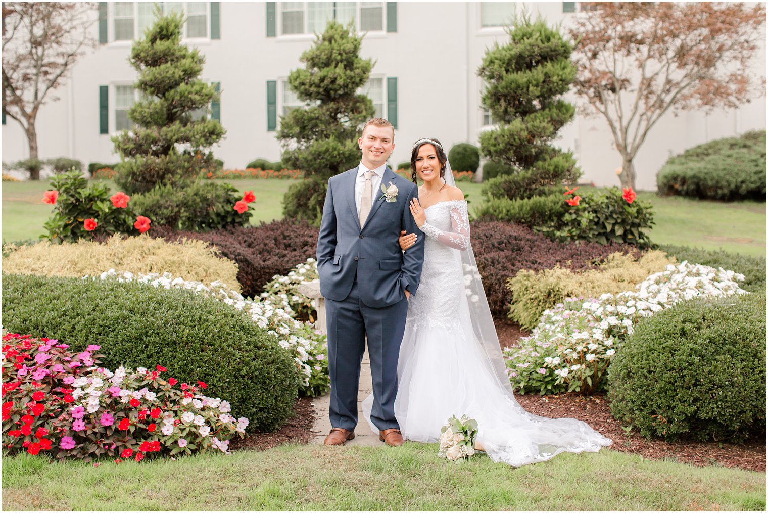 Seaview Hotel wedding portraits of bride and groom in garden