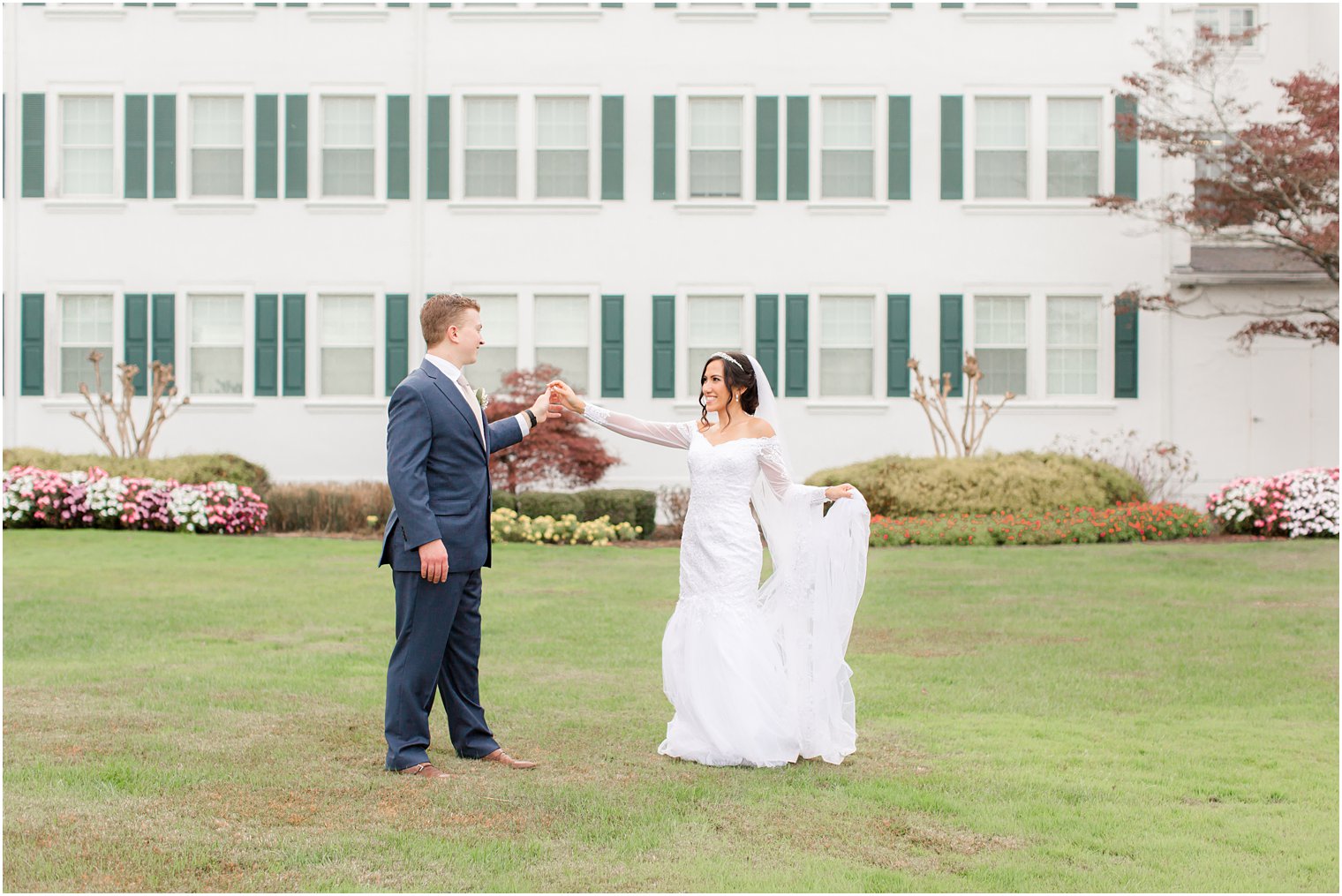 bride and groom dance on front lawn of Seaview Hotel