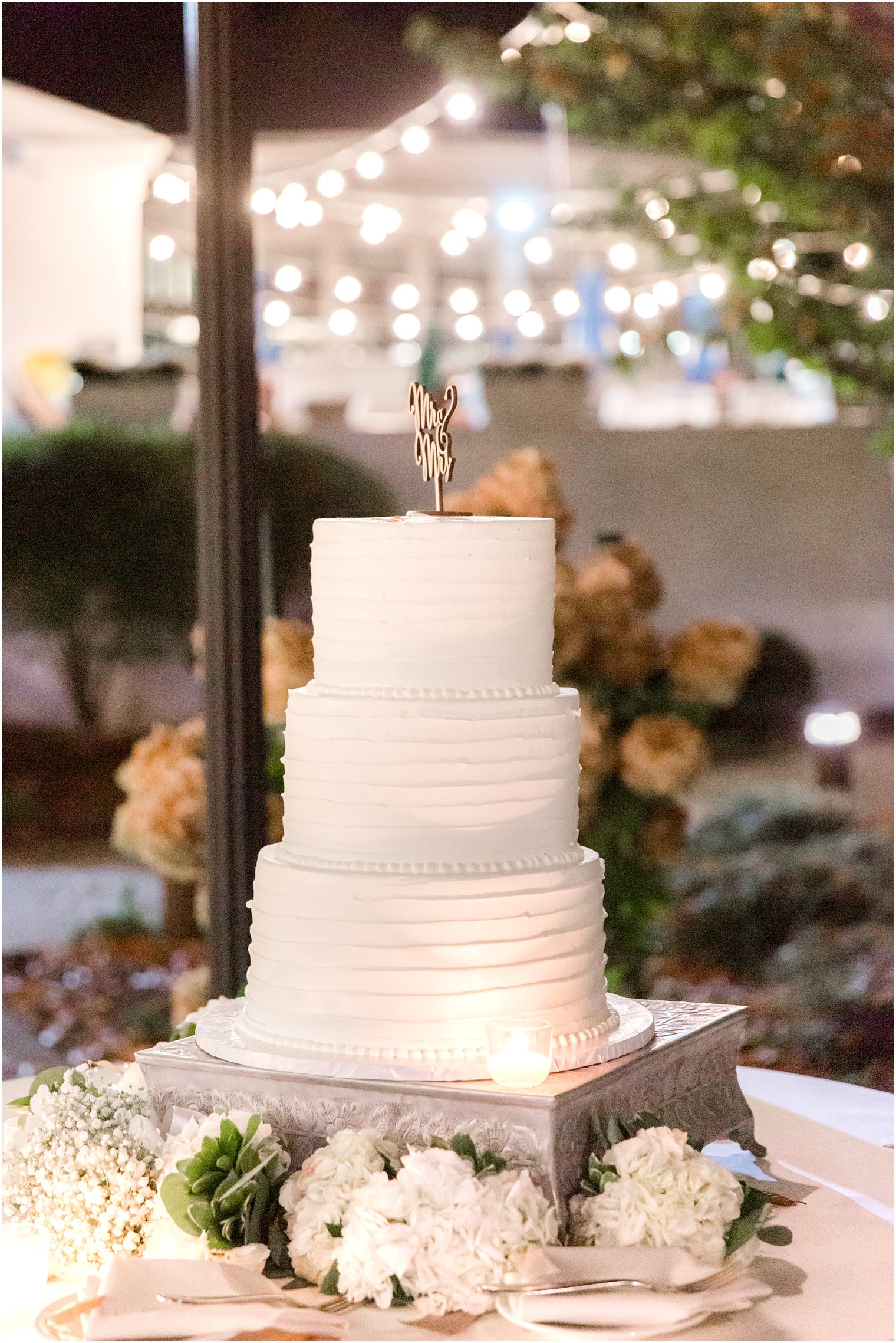 tiered wedding cake with wooden topper at Seaview Hotel Wedding