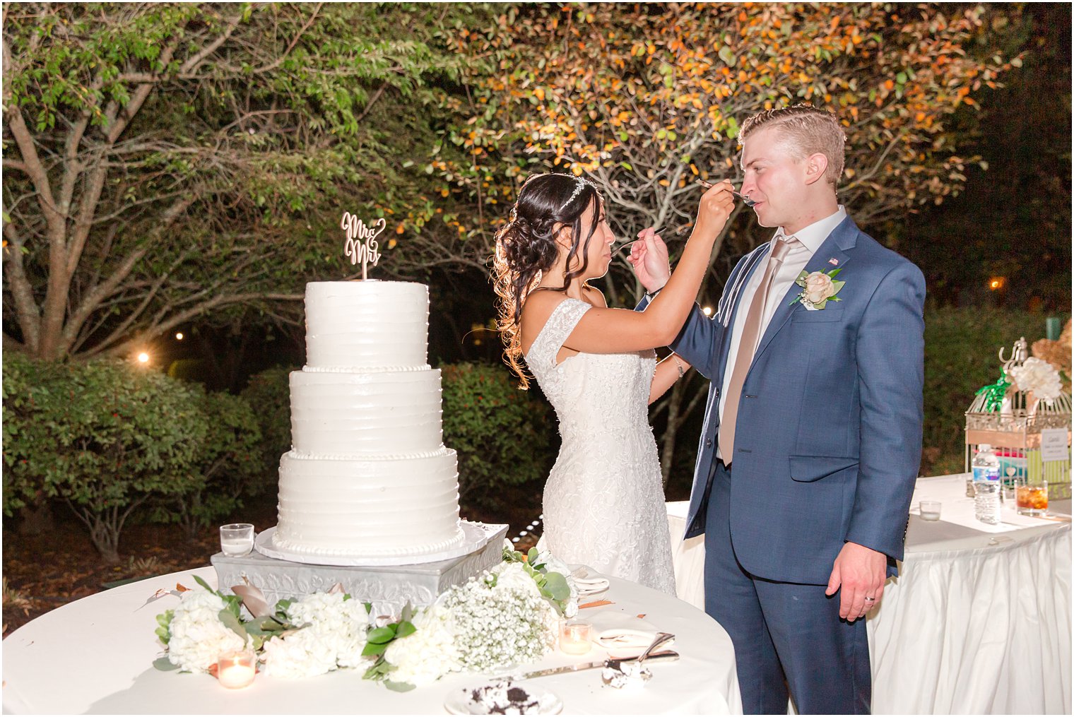 newlyweds cut wedding cake during Seaview Hotel Wedding reception