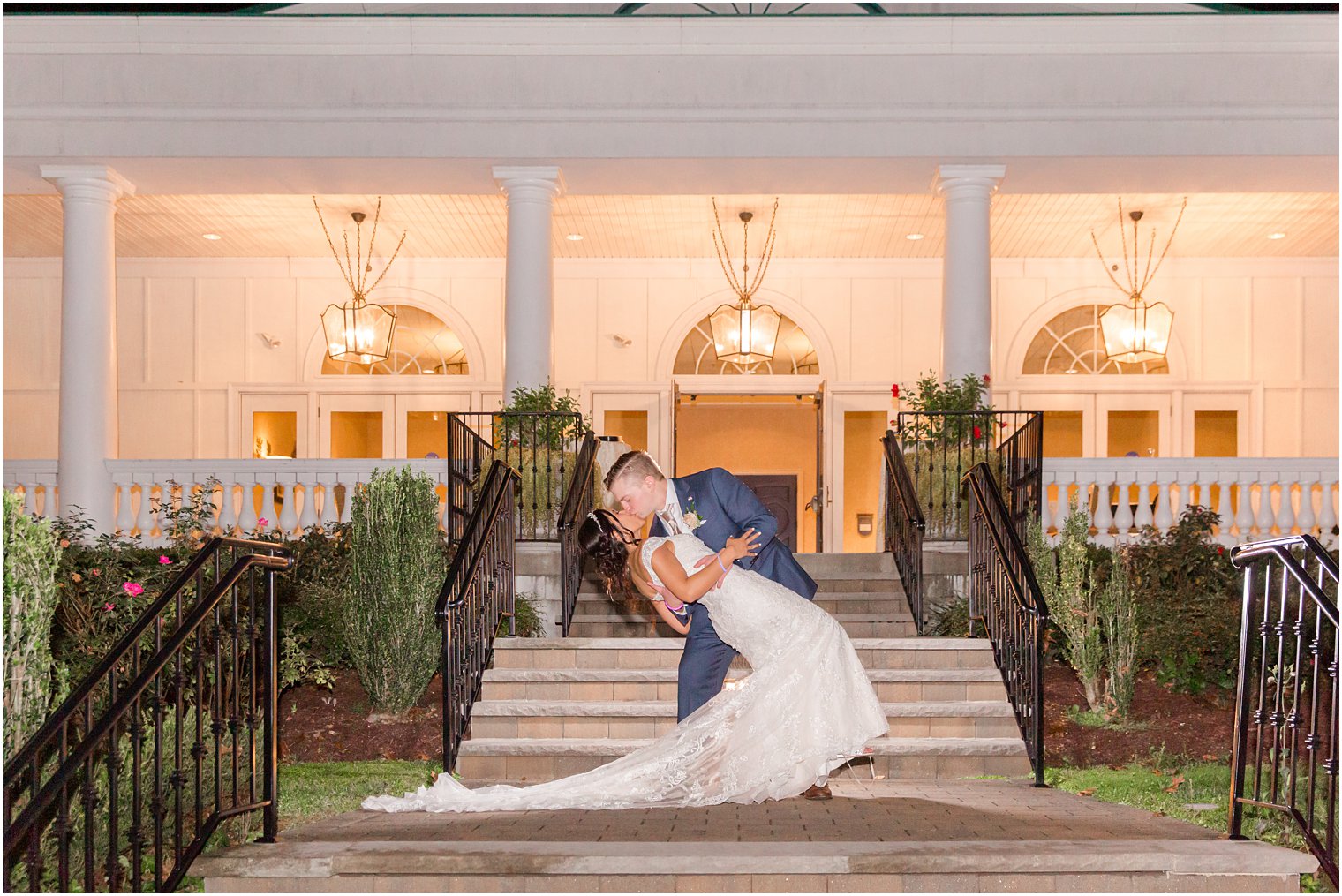 bride and groom kiss outside Seaview Hotel