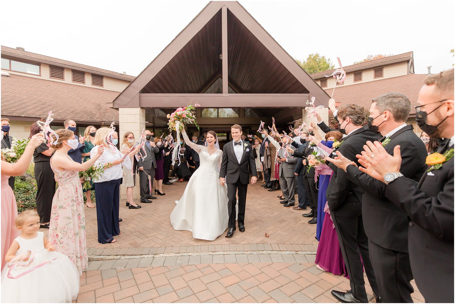 bride and groom leave church after New Jersey wedding