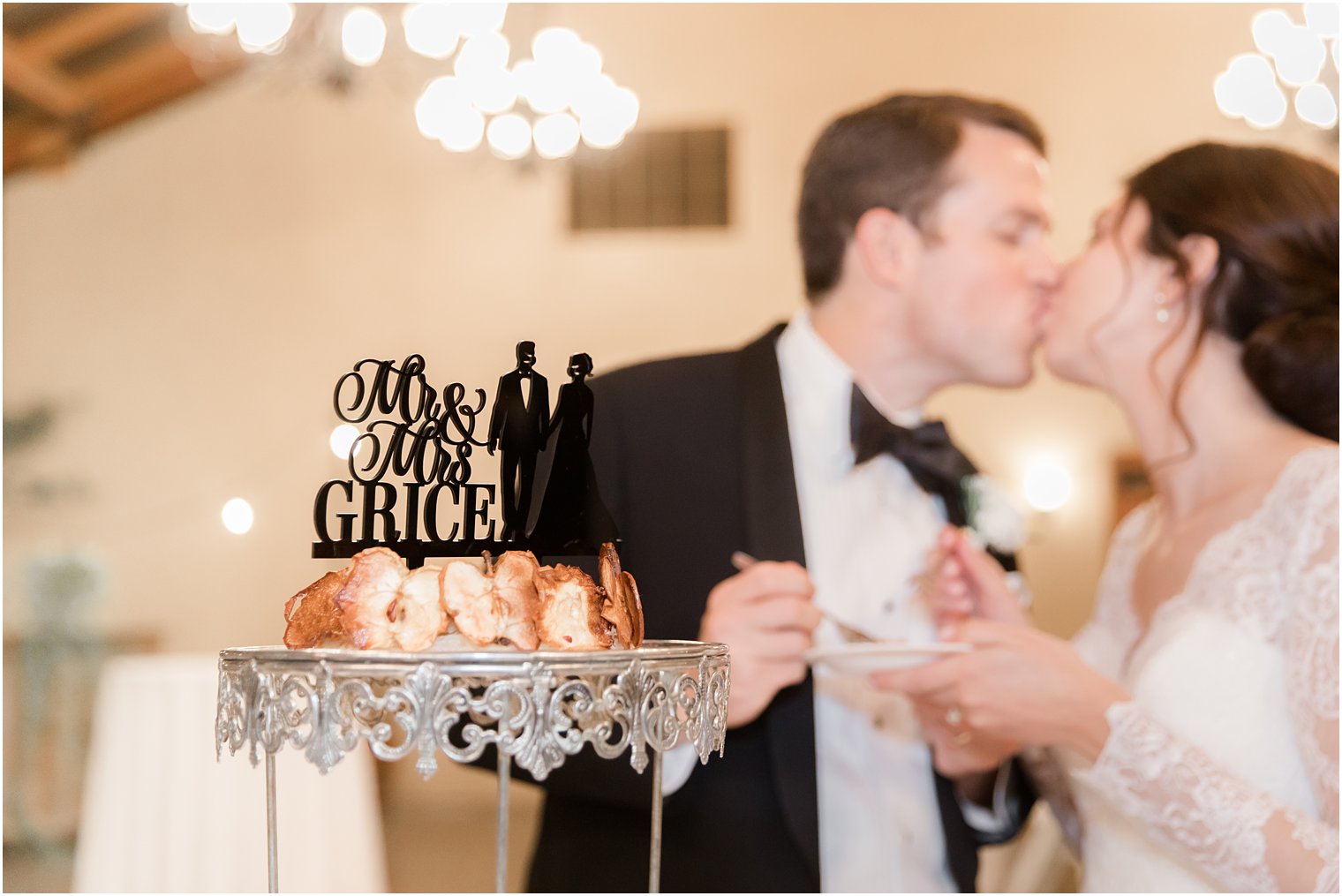 bride and groom cut wedding cake during NJ wedding reception