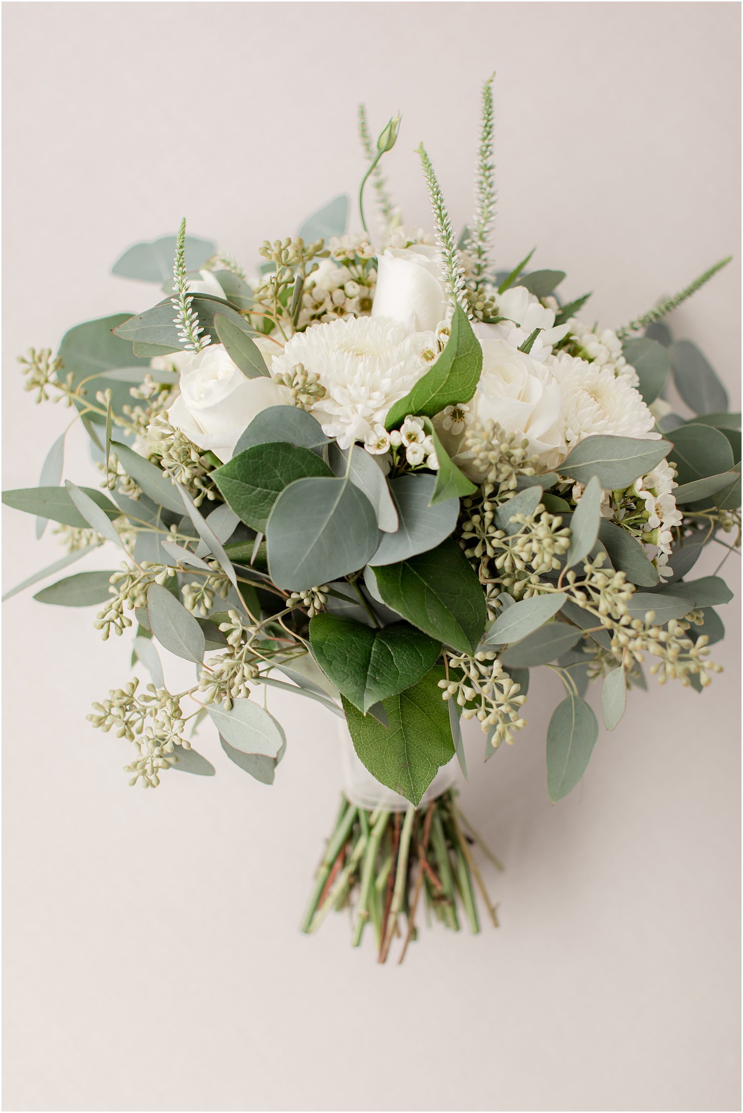 bridal bouquet with white flowers and green accents by Wildflowers Florist for The Mill Lakeside Manor Wedding