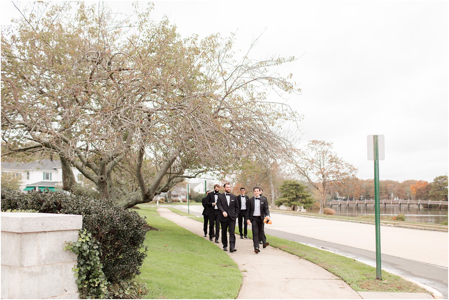 groom and groomsmen walk to church in New Jersey