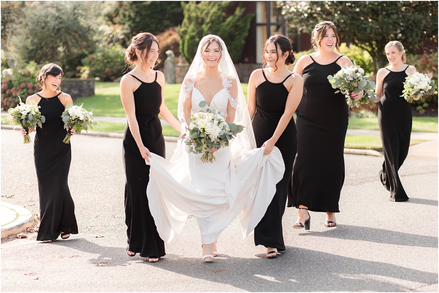 bride walks to St. Catharine's Church for wedding in Spring Lake NJ