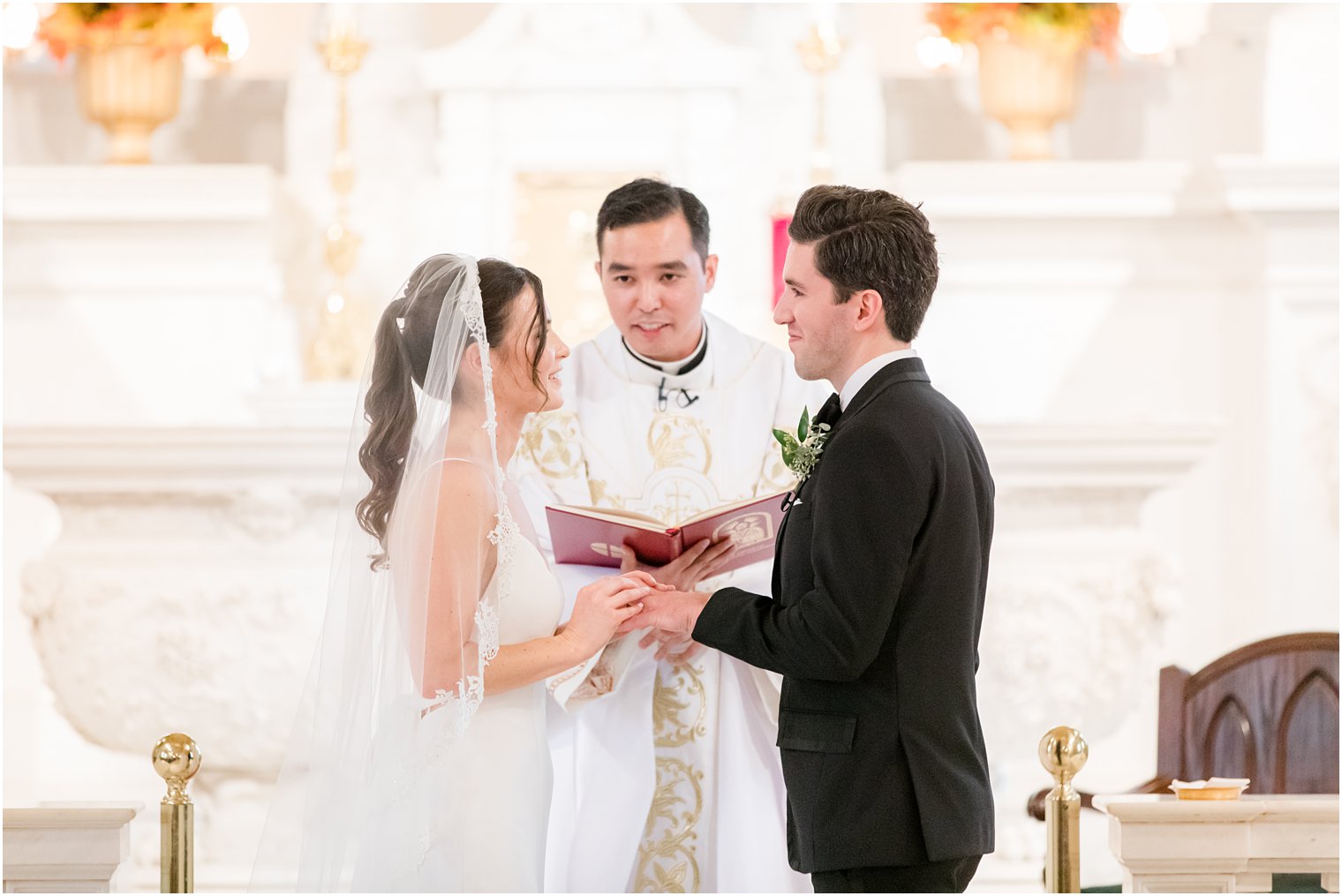 bride and groom exchange vows during traditional church wedding at St. Catharine's Church in Spring Lake NJ