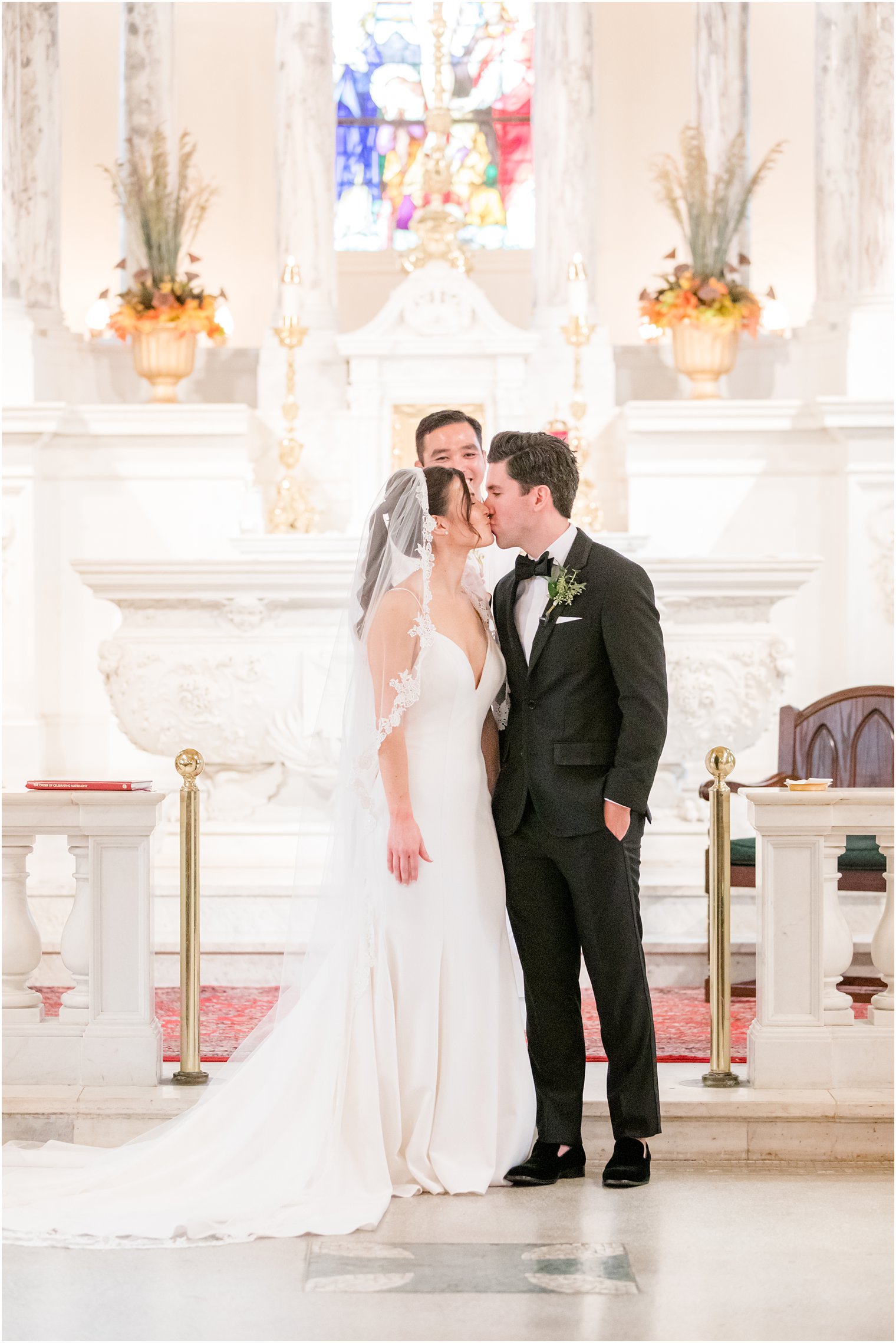 first kiss at traditional church wedding at St. Catharine's Church in Spring Lake NJ