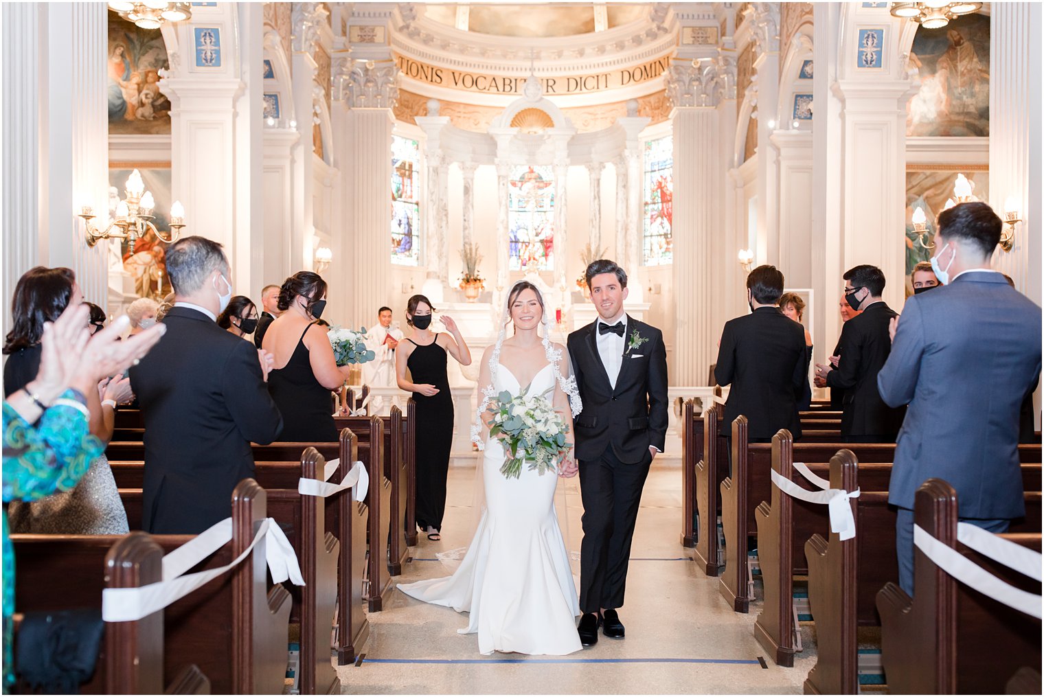 newlyweds leave traditional church wedding at St. Catharine's Church in Spring Lake NJ