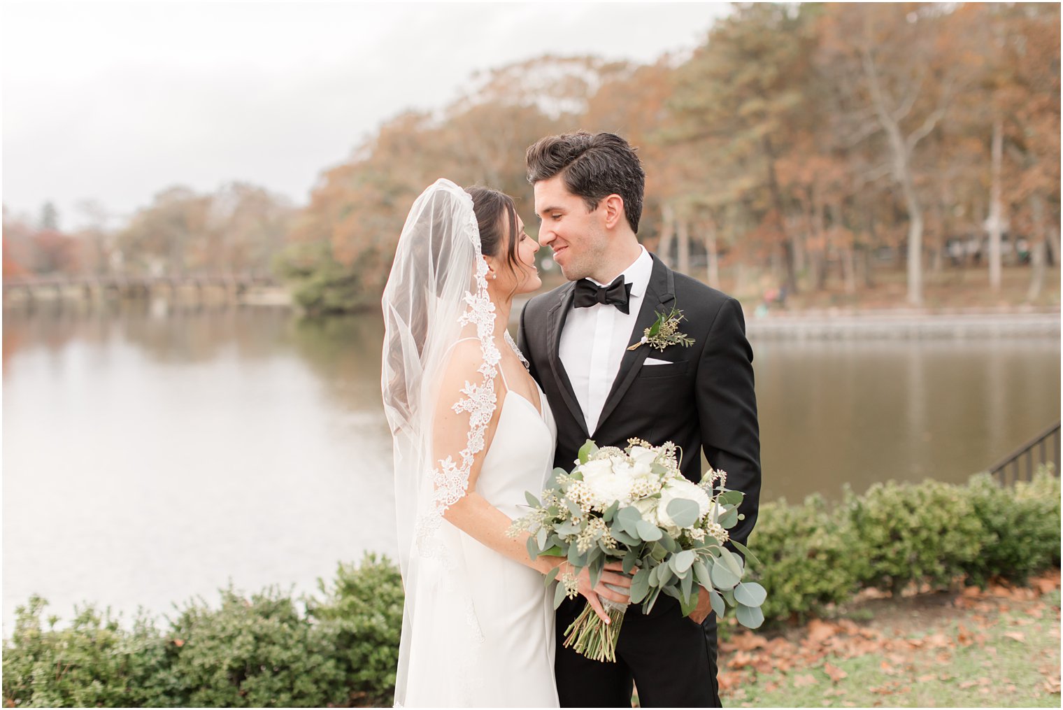 newlyweds touch noses during Spring Lake NJ wedding photos