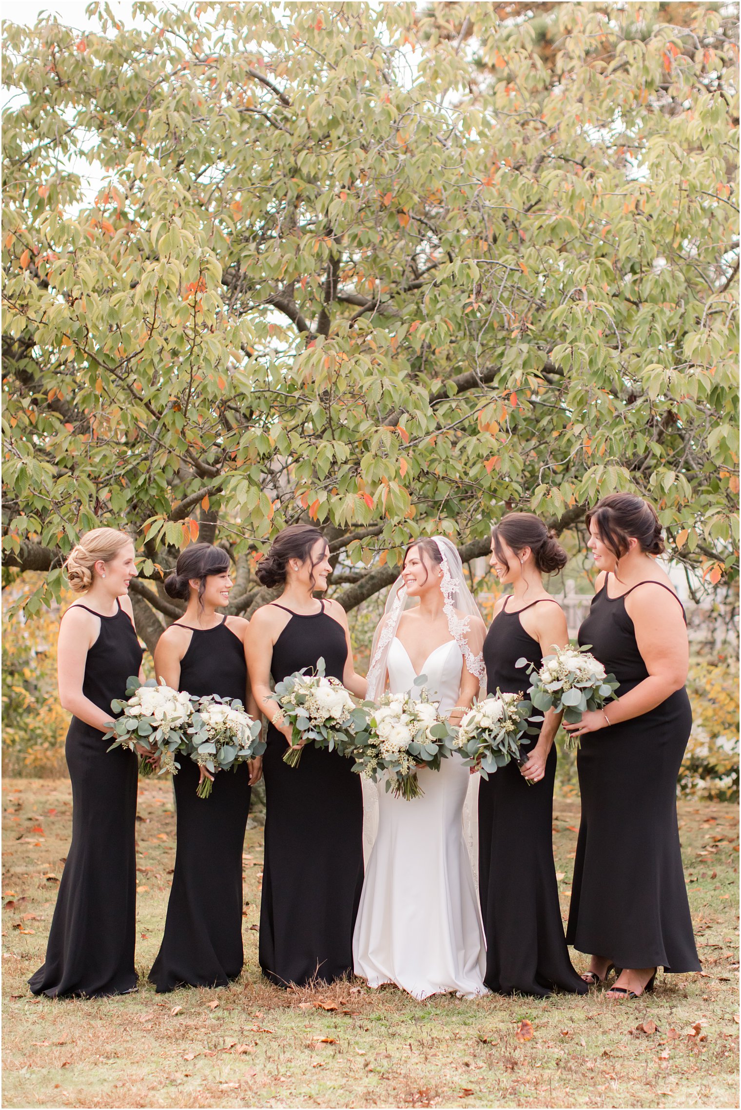 bride poses with 5 bridesmaids in New Jersey