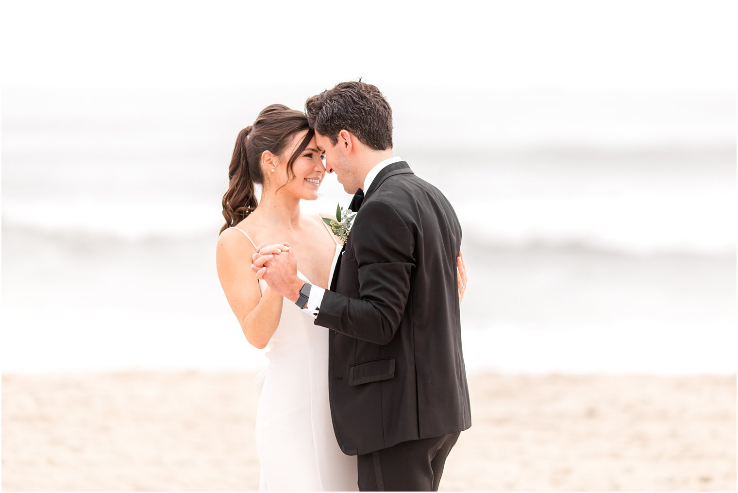 newlyweds dance on beach after New Jersey wedding