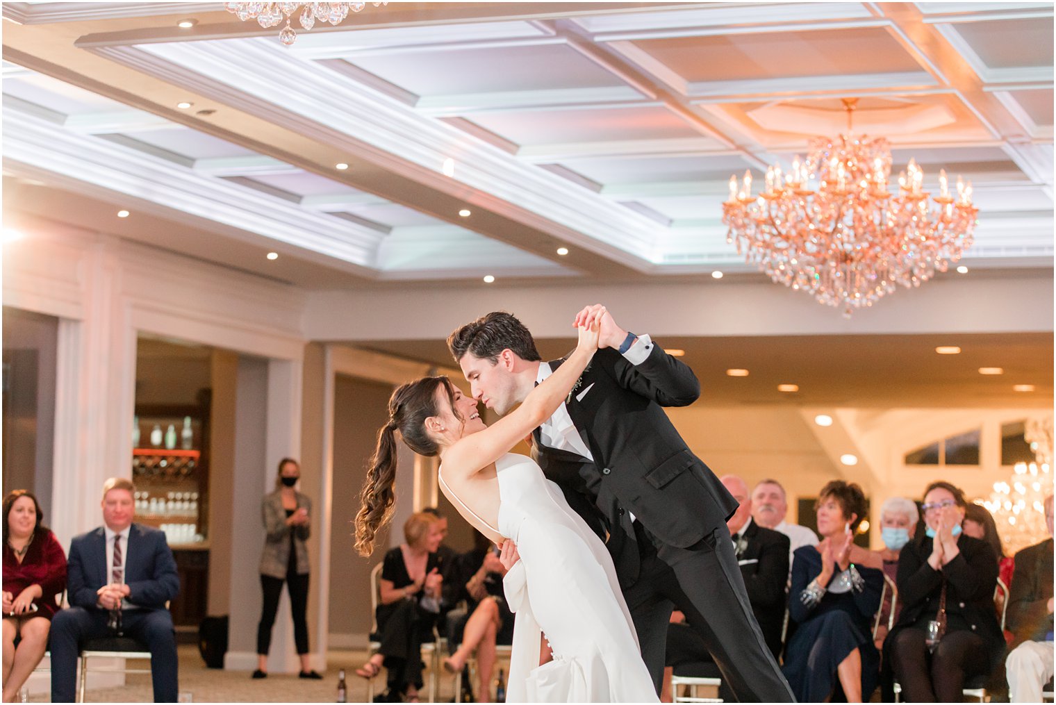 groom dips bride during dance at The Mill Lakeside Manor wedding