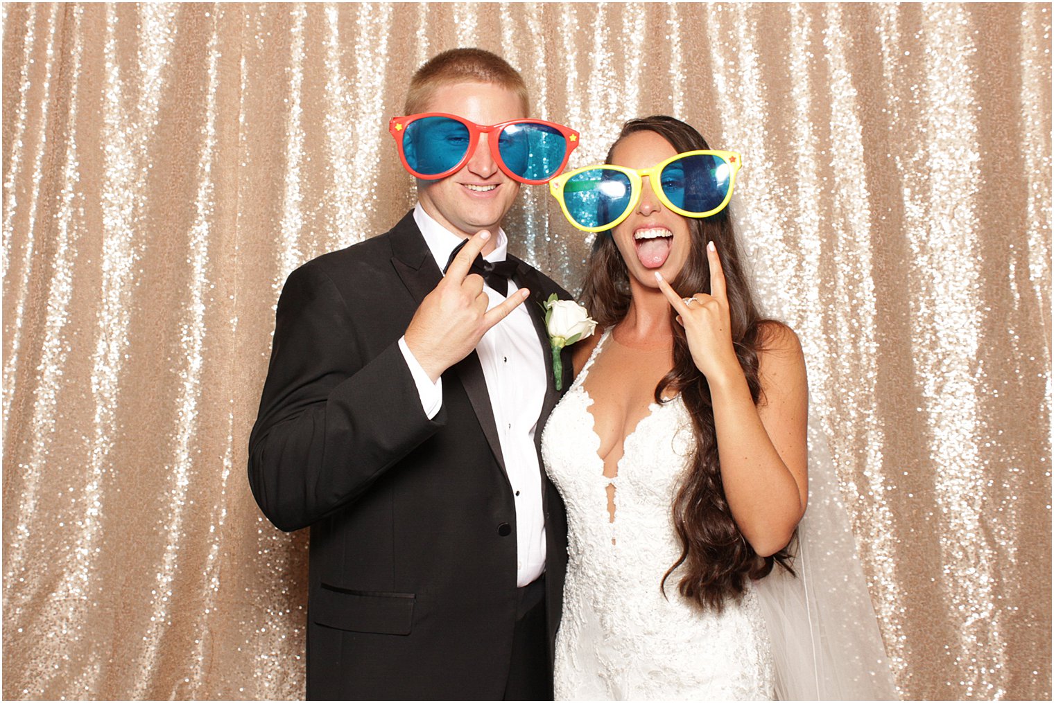 bride and groom wear sunglasses during photo booth at Bridgeview Yacht Club