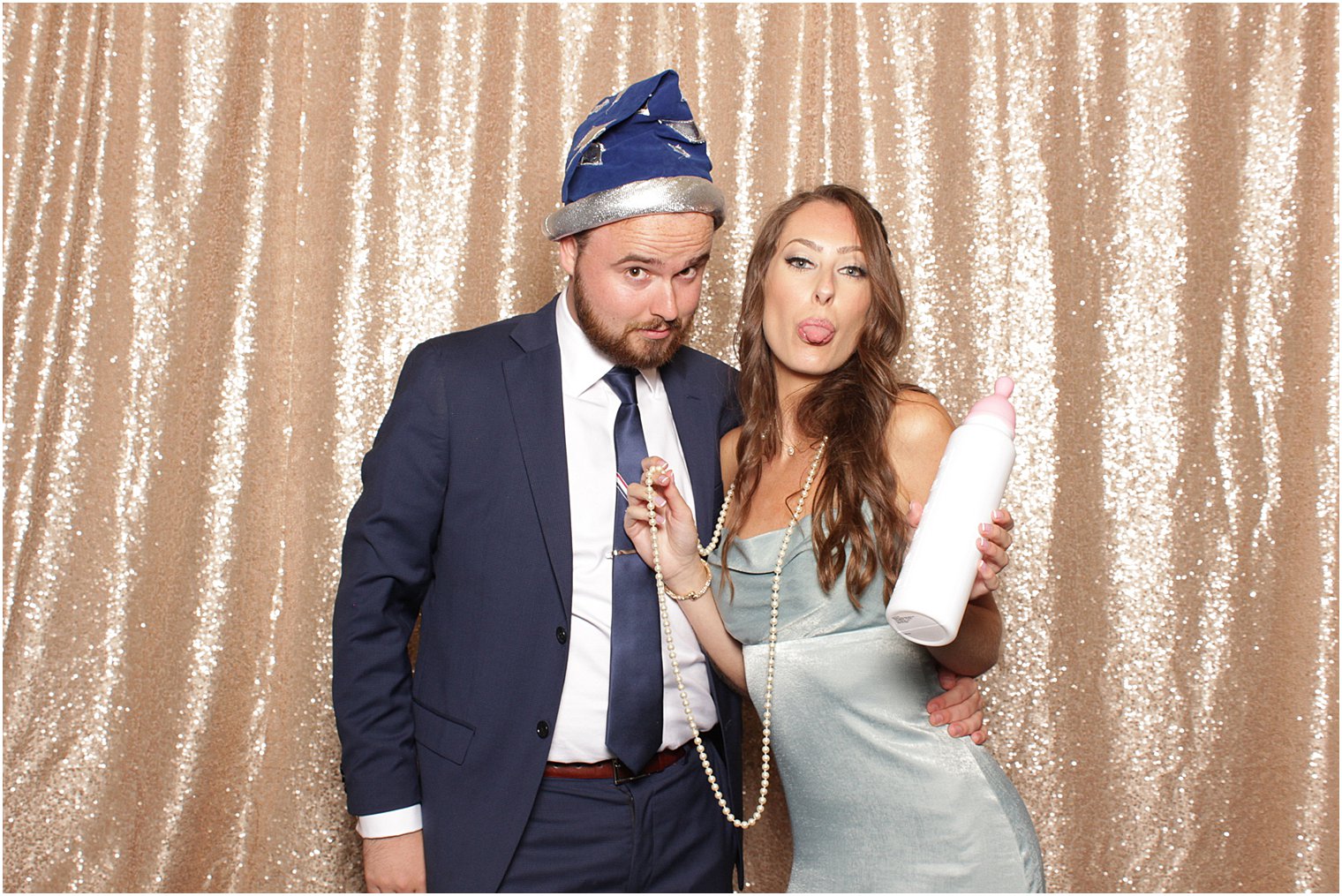 wedding guests have fun in NJ wedding reception photo booth