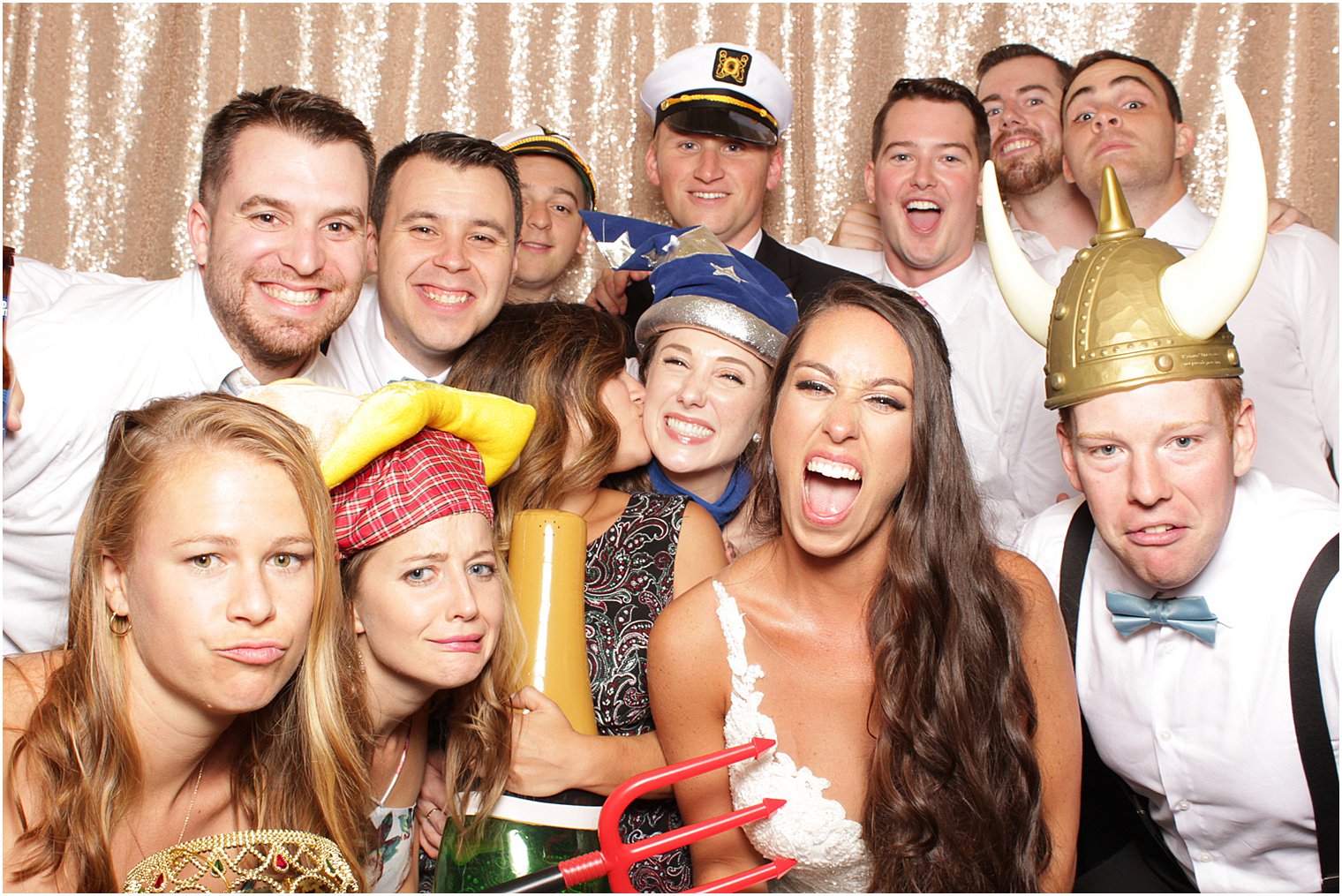 wedding guests have fun in photo booth at Bridgeview Yacht Club