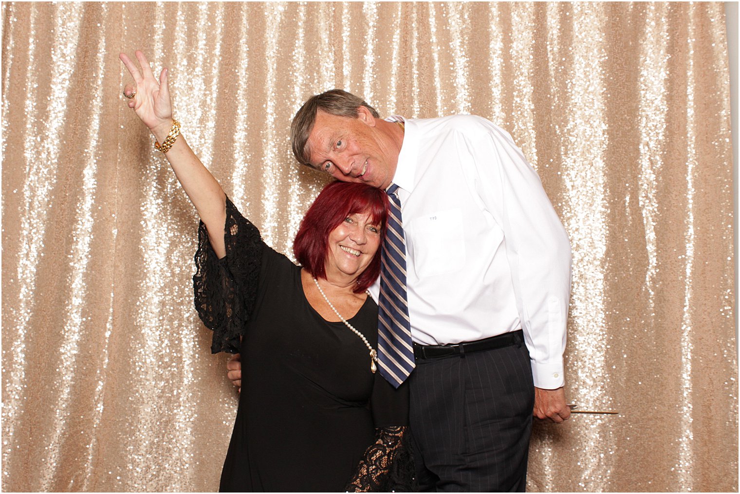 wedding guests pose in NJ photo booth