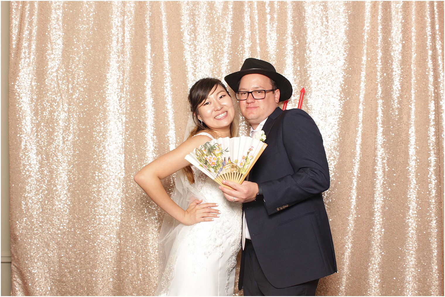 bride and groom pose in Lake Mohawk Country Club photo booth