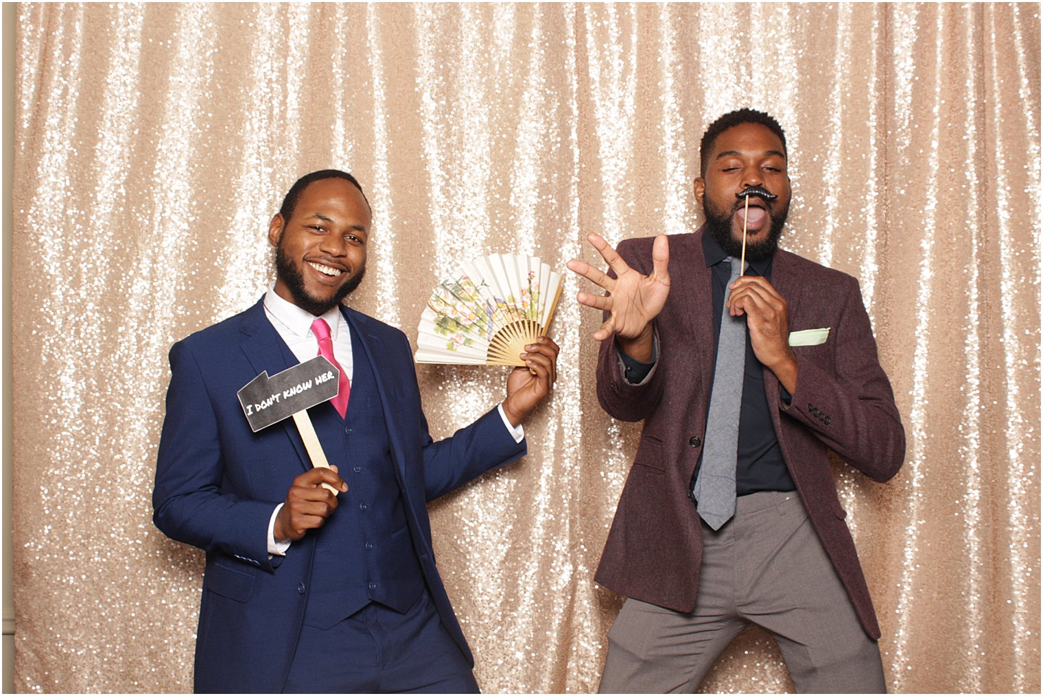 wedding guests pose in NJ photo booth
