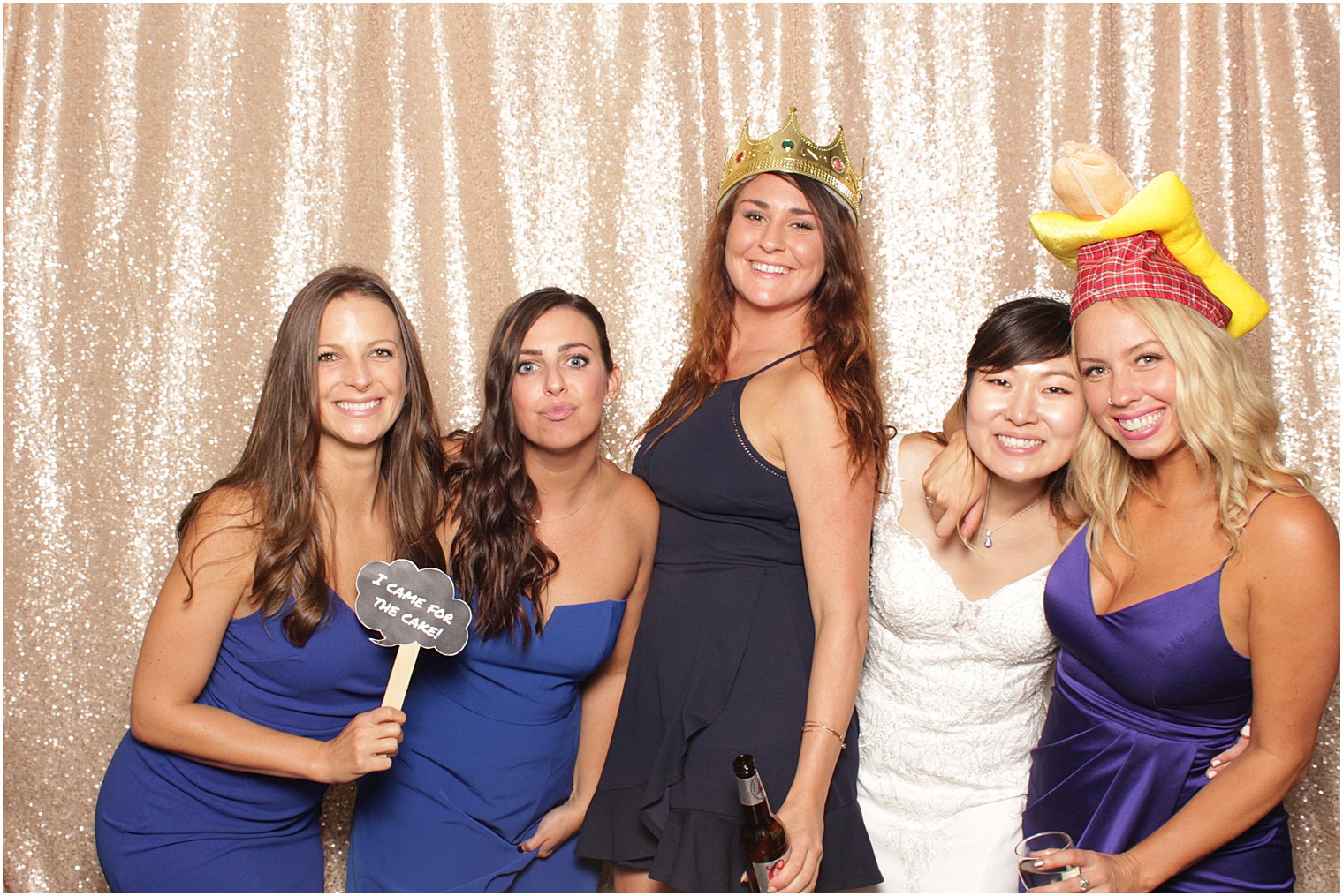 bride poses in photo booth during Lake Mohawk Country Club wedding reception