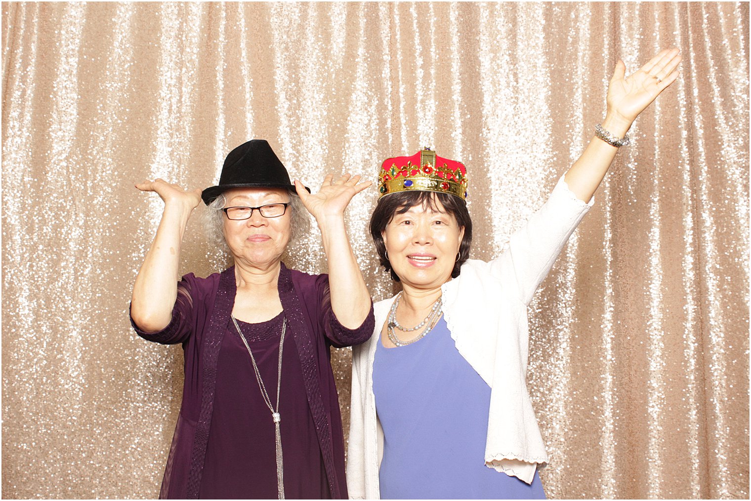 ladies laugh during fun in photo booth