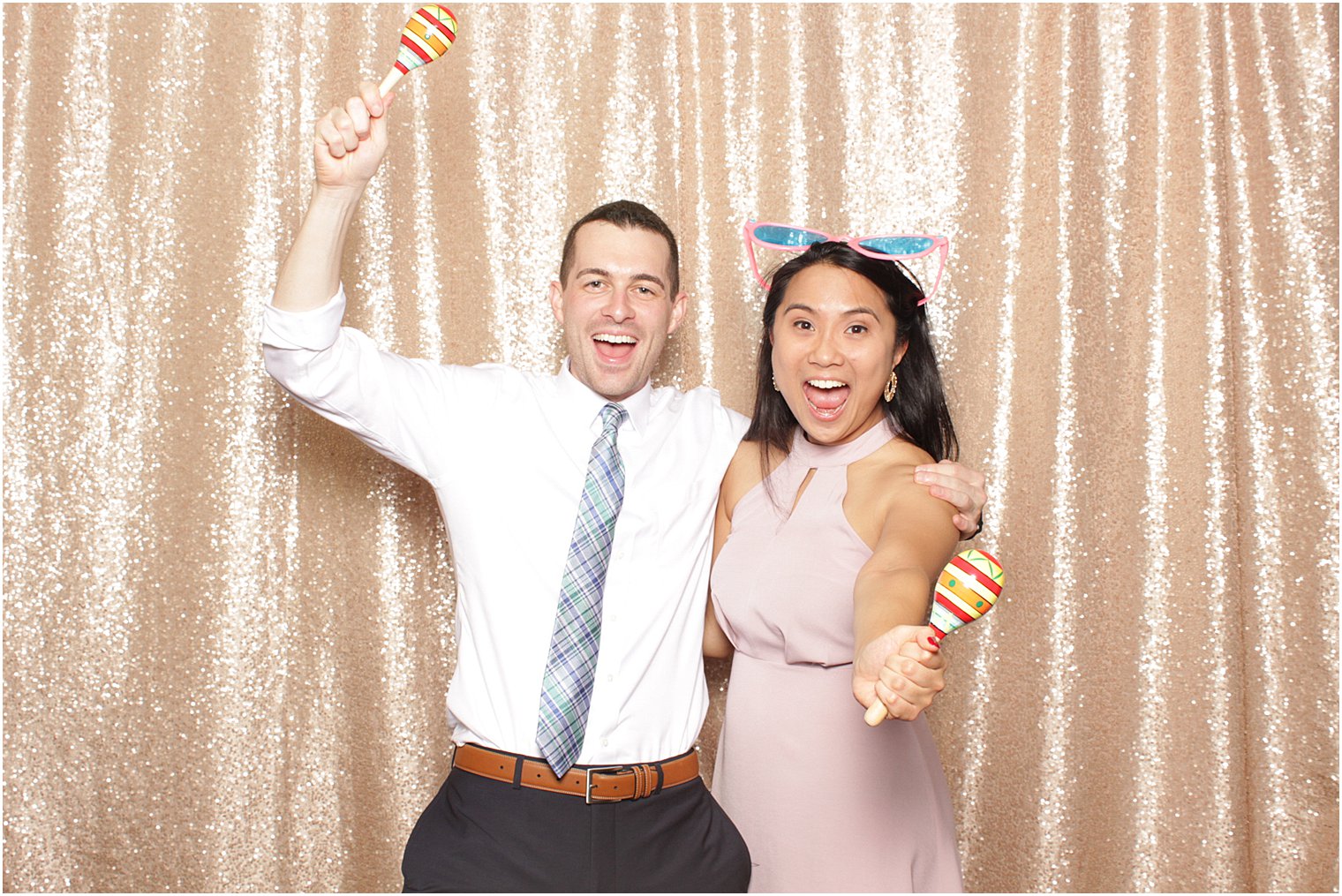 wedding guests dance during photo booth at Lake Mohawk Country Club