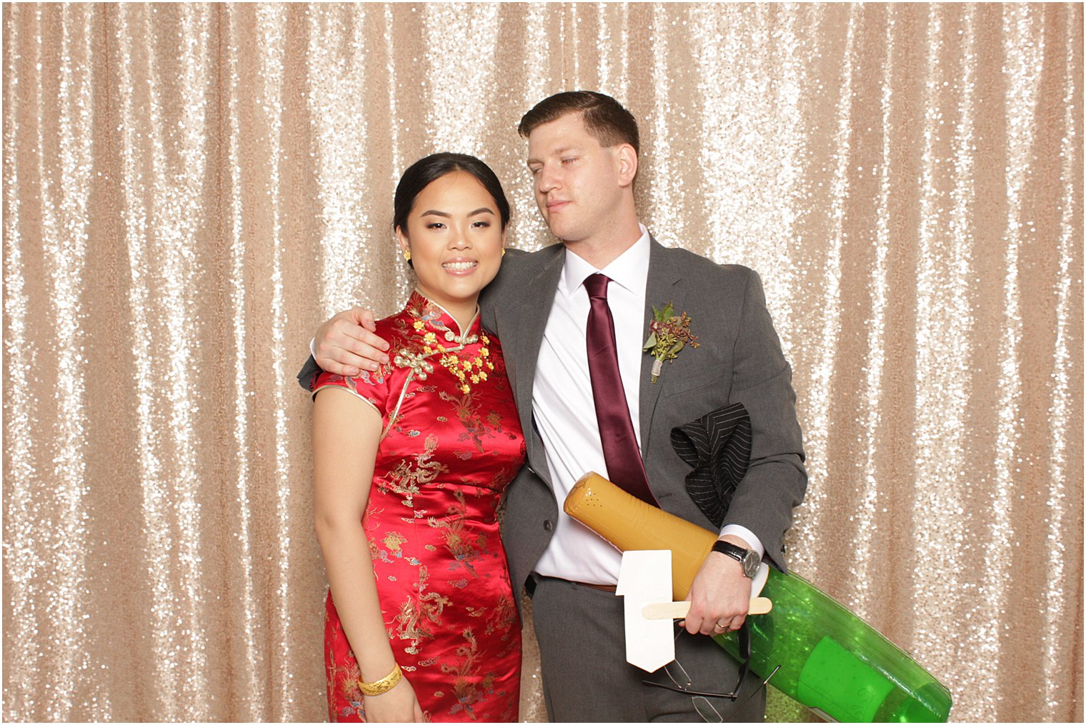 newlyweds pose in photo booth before Park Chateau Estate reception