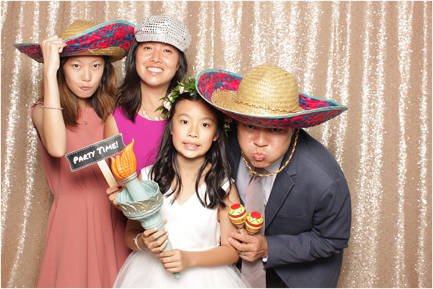 wedding guests pose in photobooth during NJ wedding reception