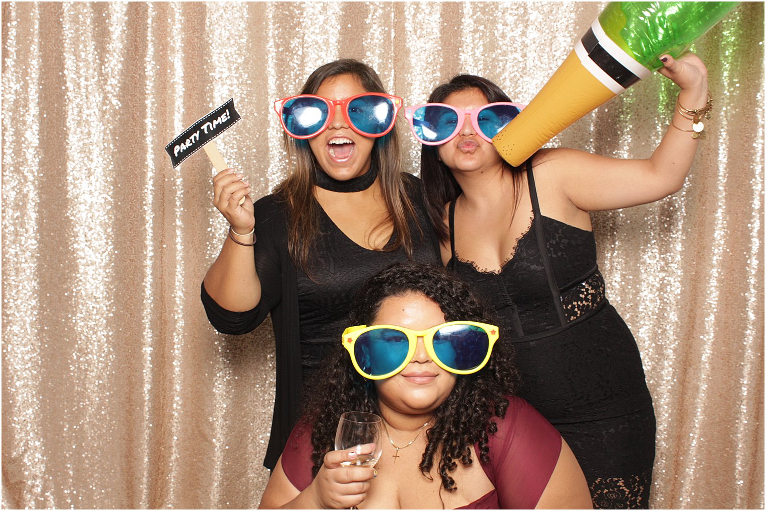 wedding guests play in photo booth during NJ wedding reception