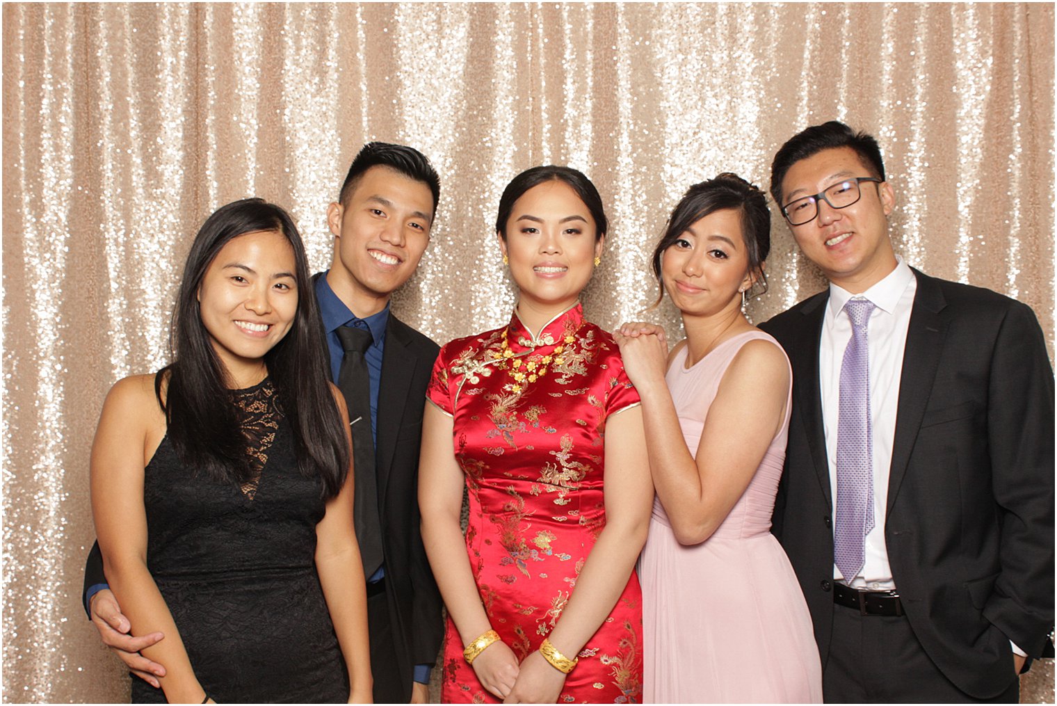 bride poses with family in Park Chateau Estate Photo Booth