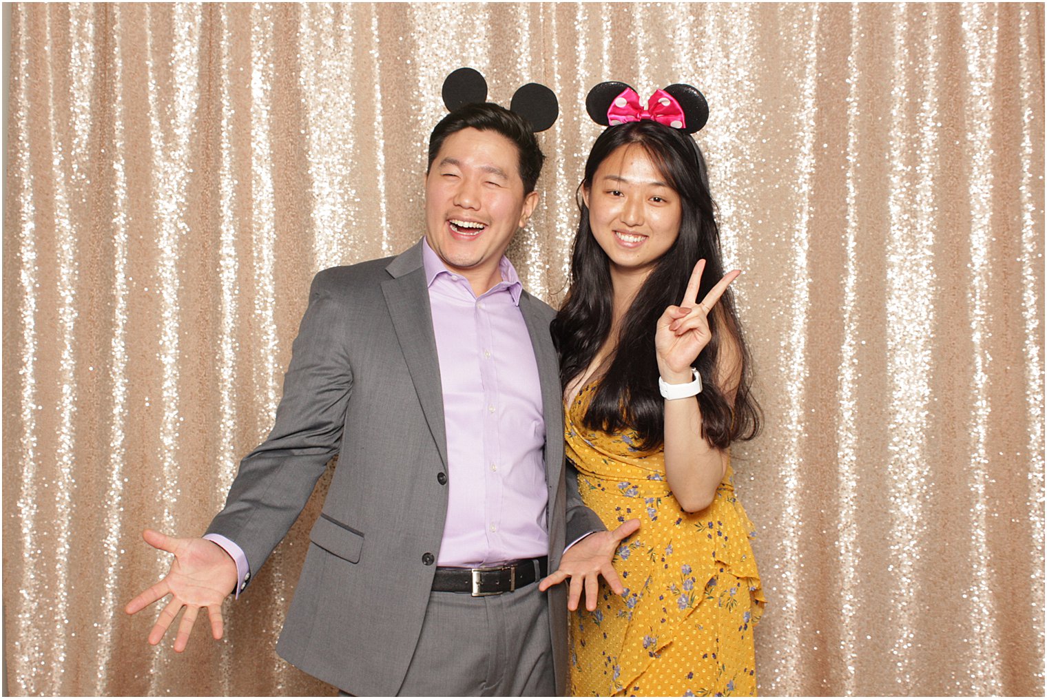 wedding guests pose in photobooth