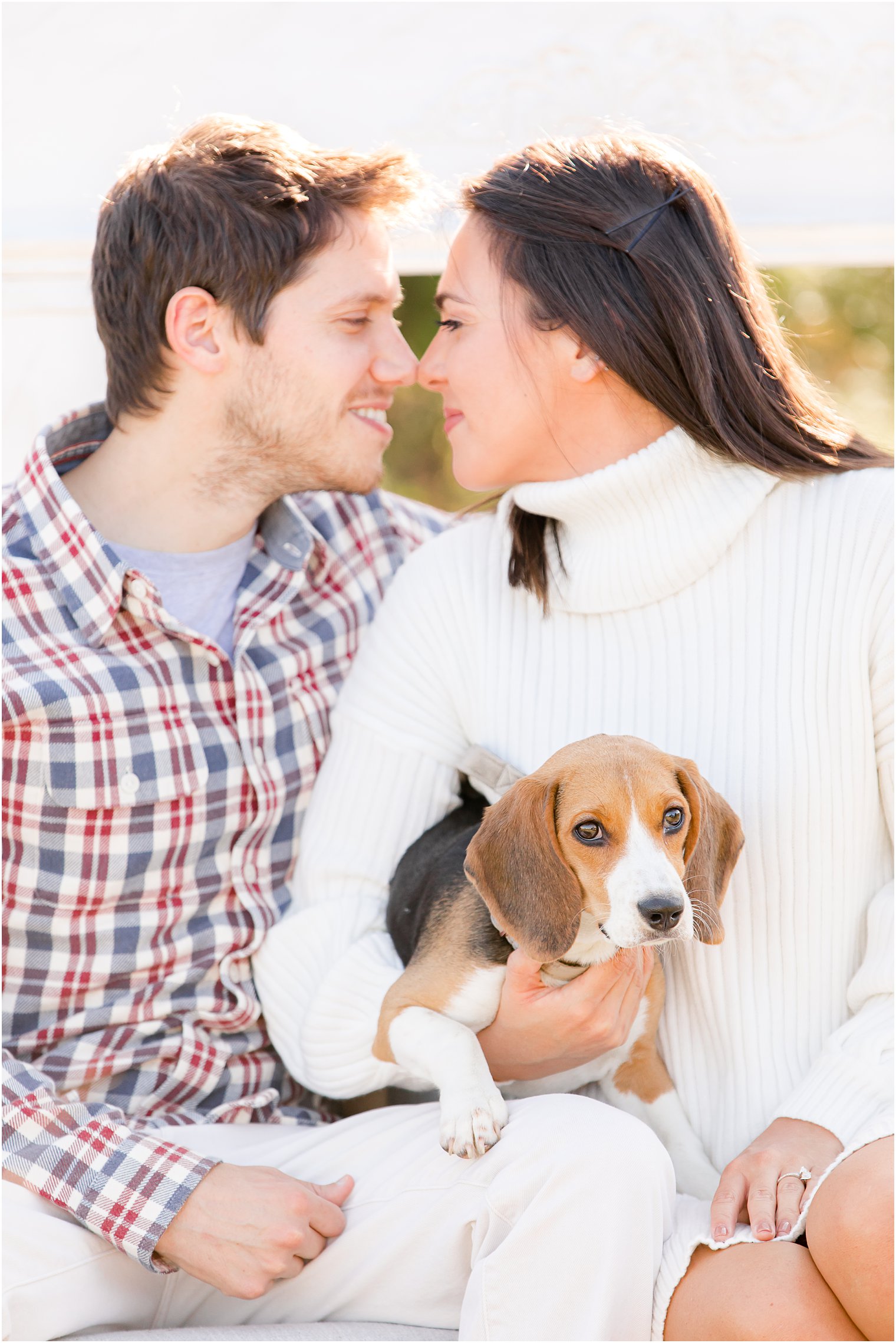 bride and groom hold puppy during NJ engagement session
