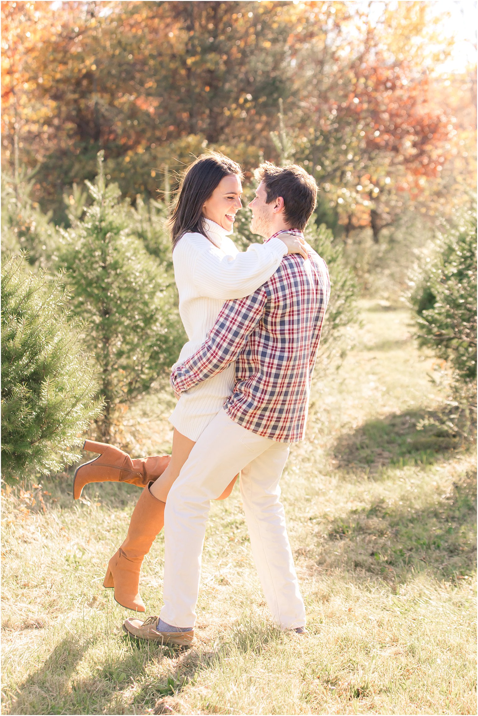 Christmas Tree Farm engagement session along trees