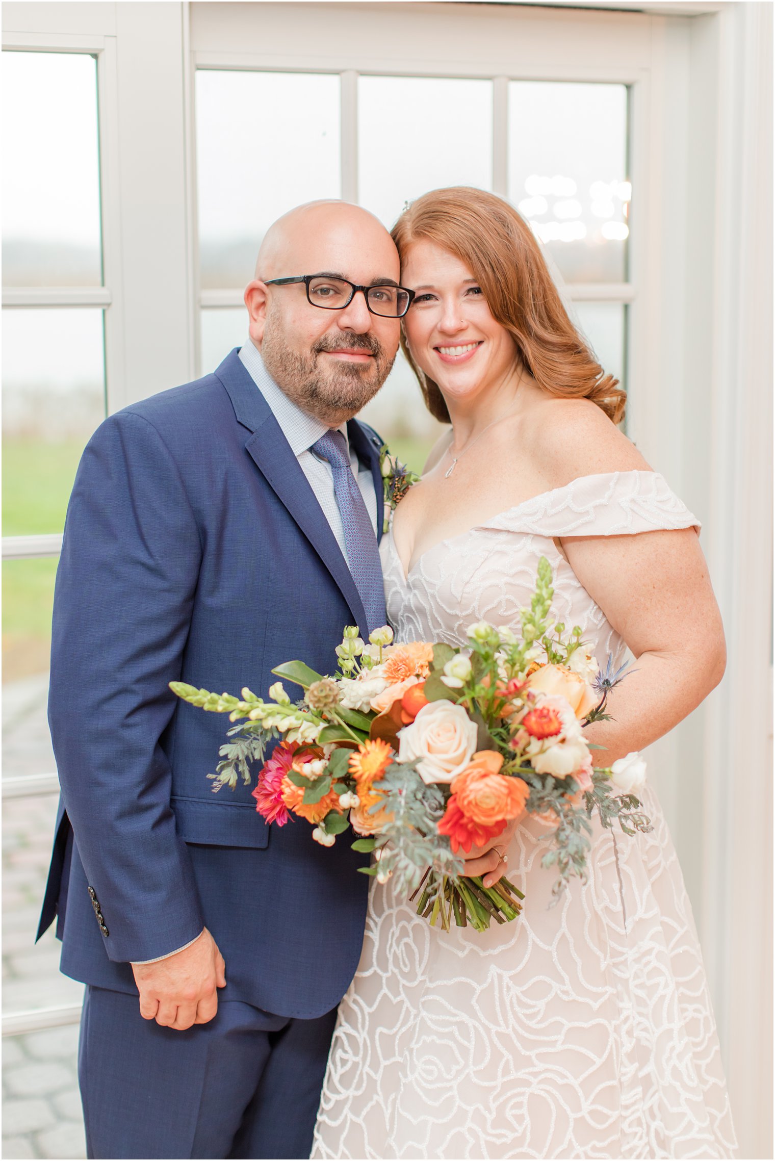 bride and groom pose together before Eagle Manor wedding