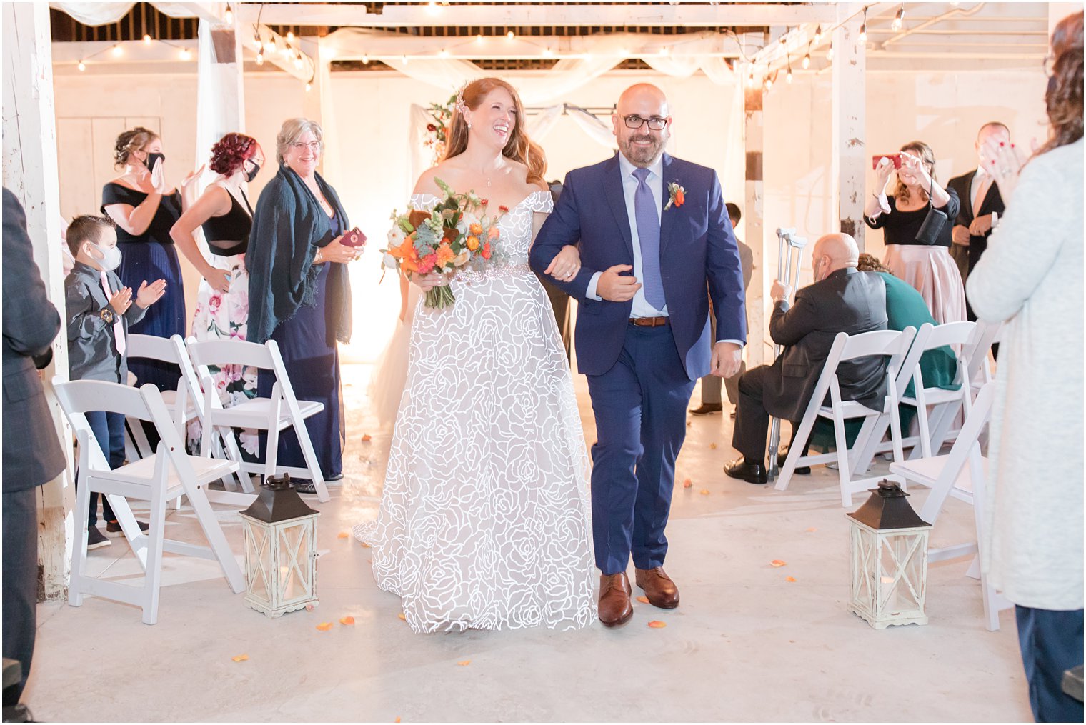 newlyweds walk up aisle after Eagle Manor wedding ceremony