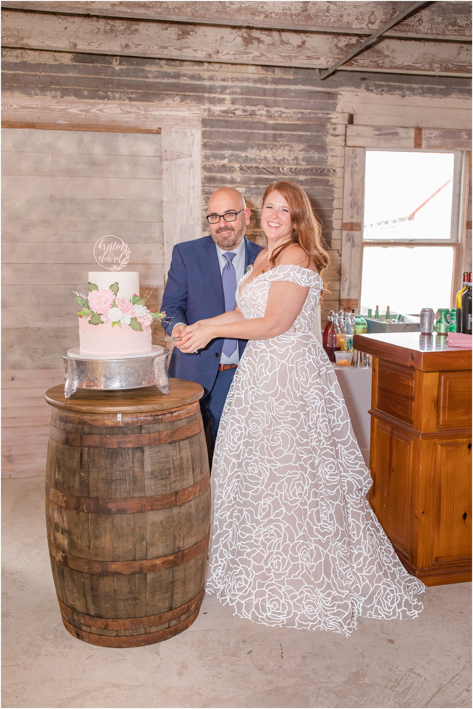 newlyweds cut wedding cake during NJ wedding reception