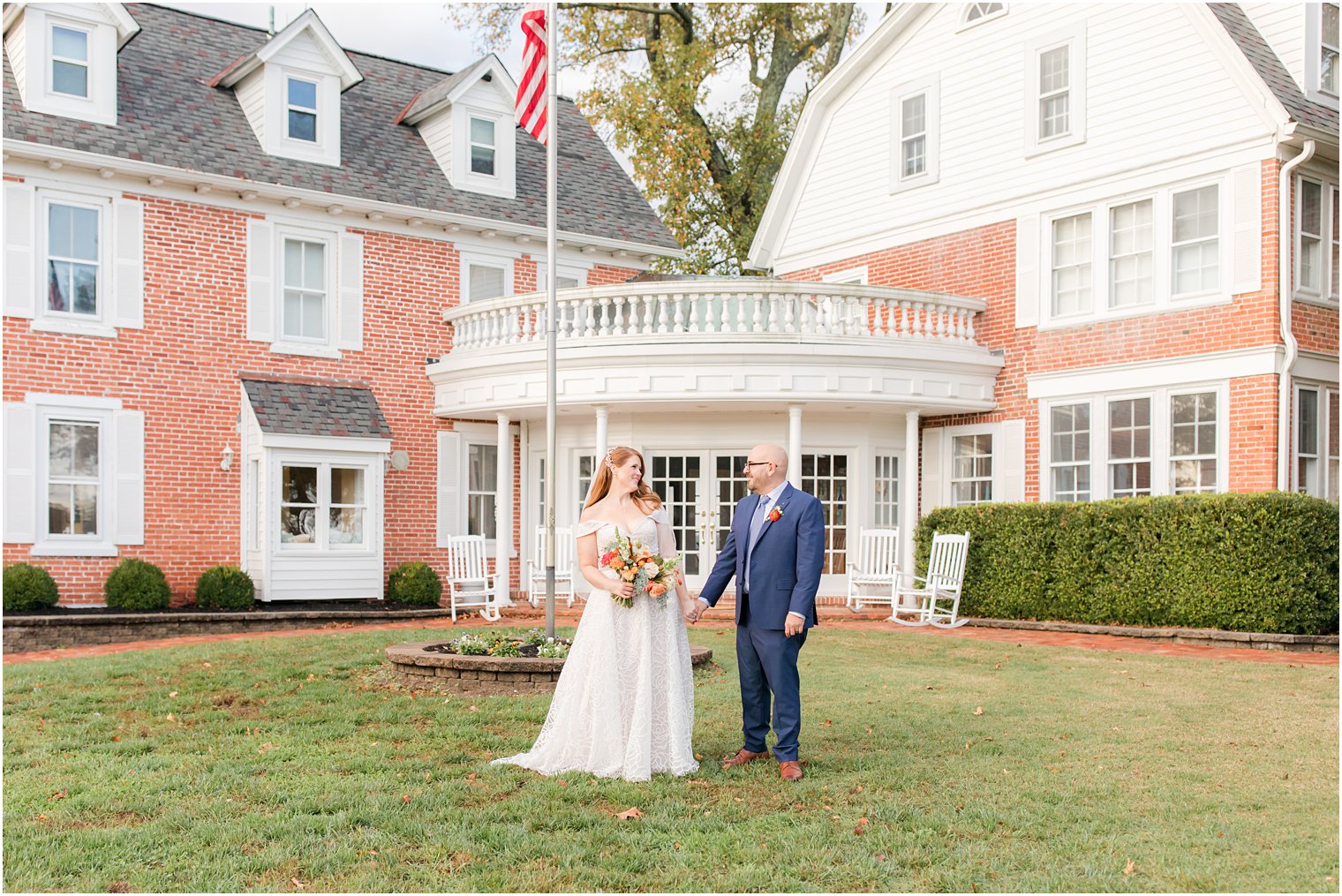 bride and groom walk outside Eagle Manor