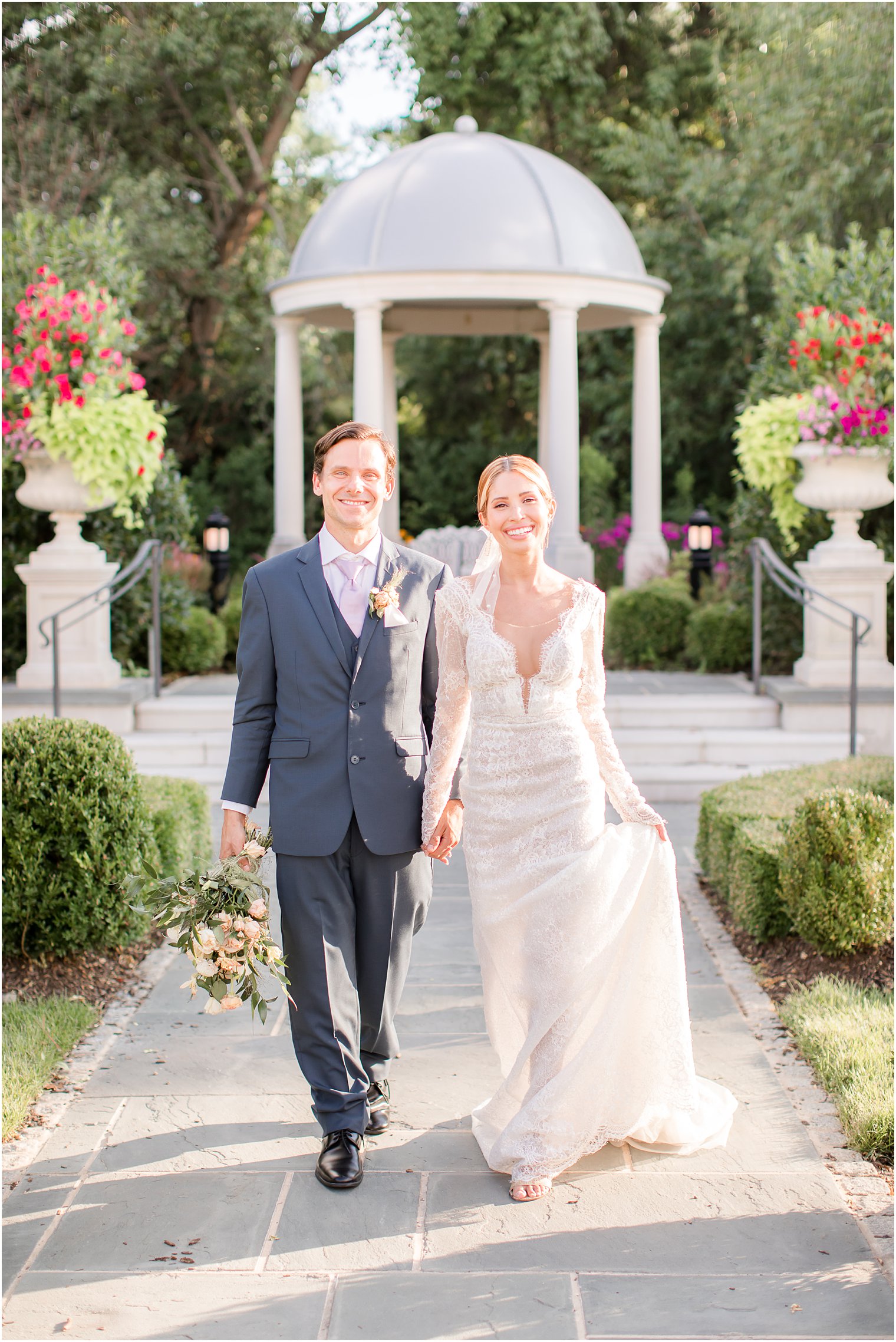 Bride and groom walking at Park Chateau Estate and Gardens in East Brunswick, NJ