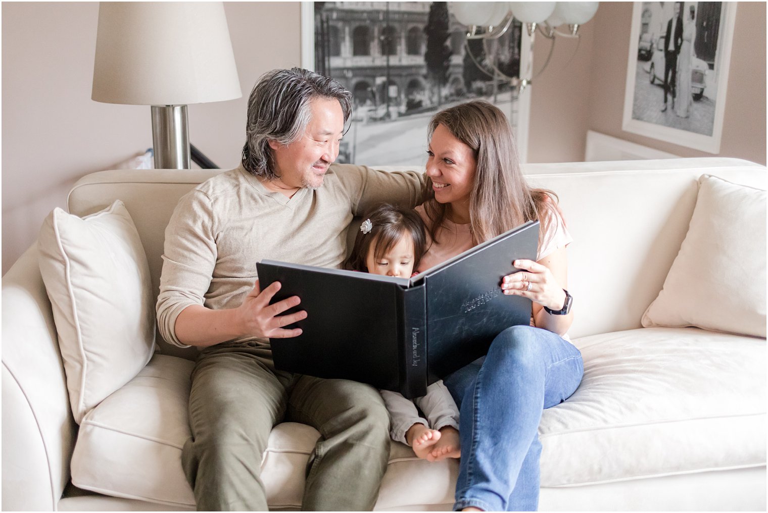 Family looking at wedding album