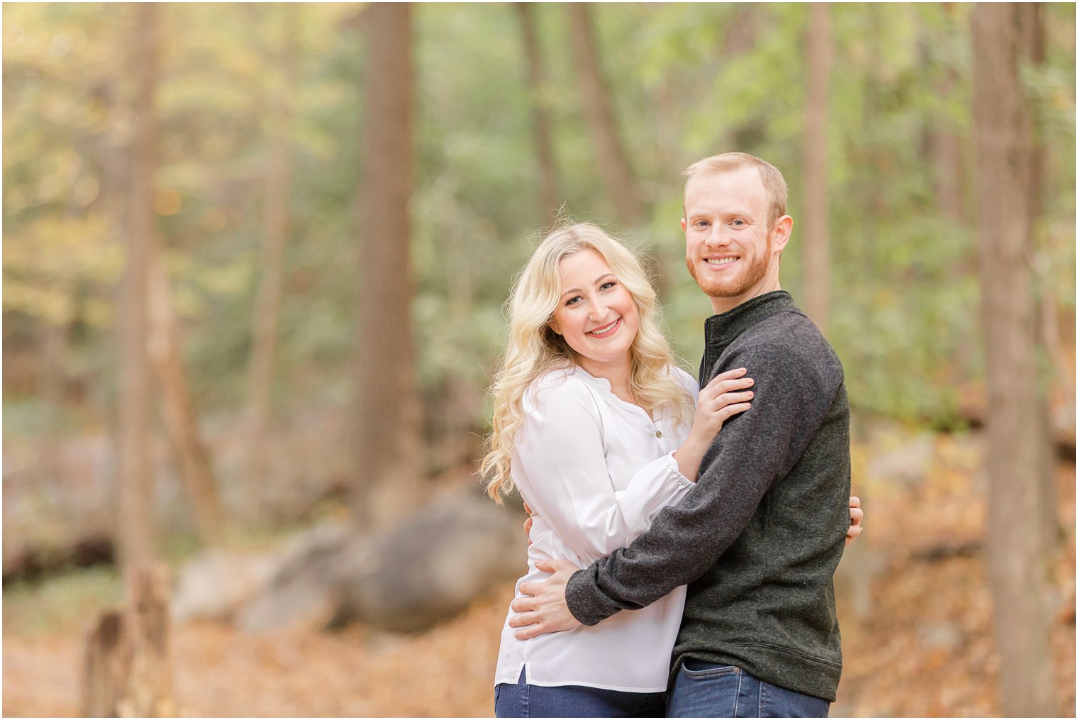 bride holds onto groom during NJ Fall Engagement Session