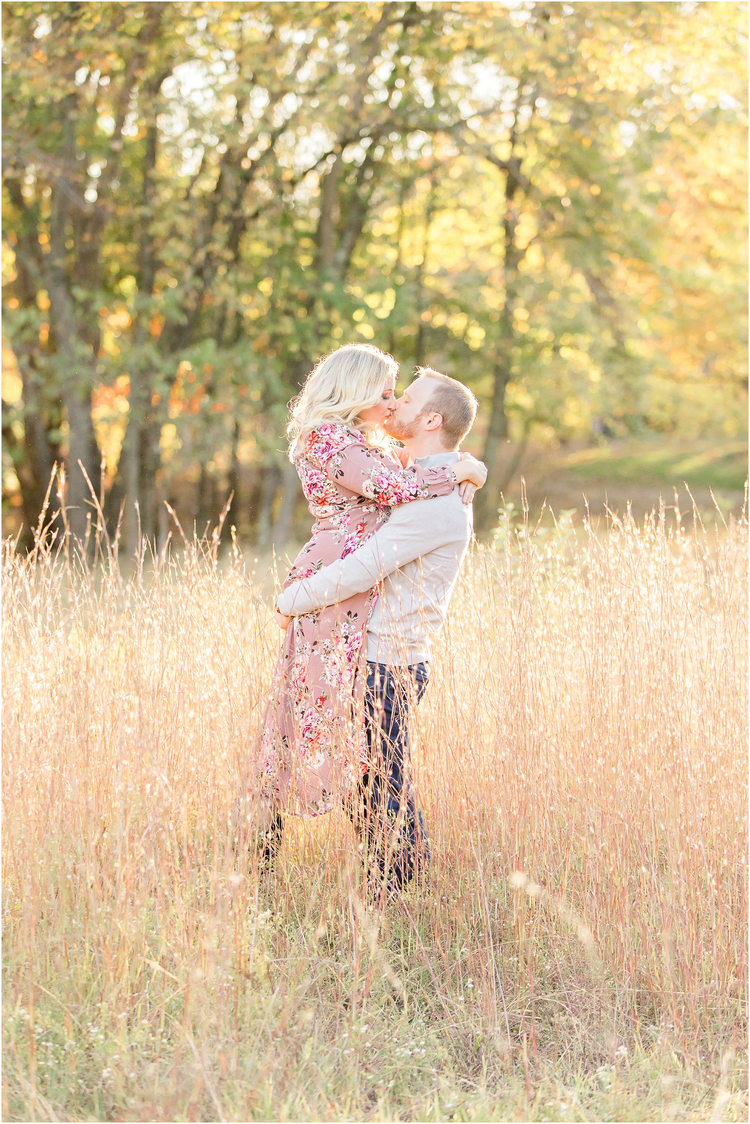 groom lifts bride off the ground during NJ engagement photos