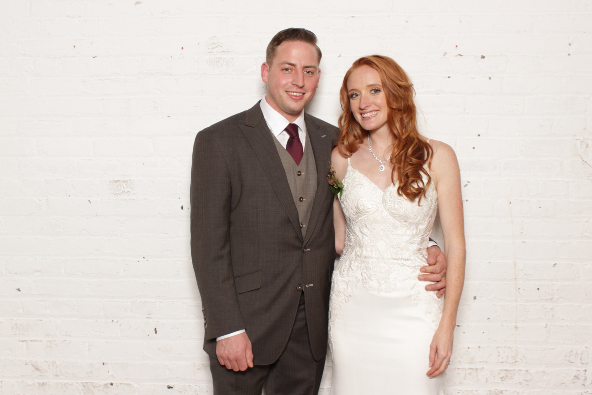 bride and groom pose during Art Factory Studios photo booth